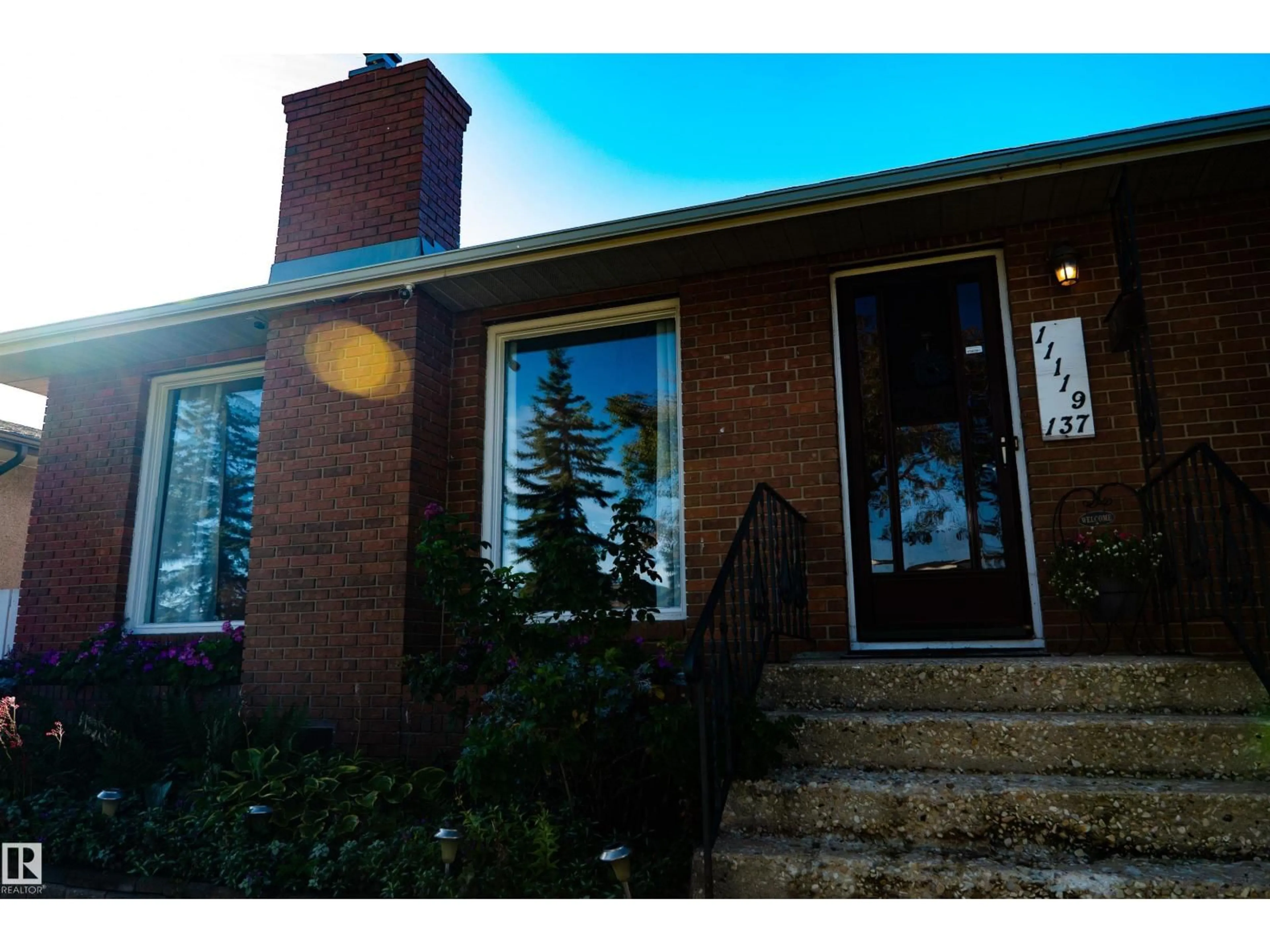 Home with brick exterior material, street for 11119 137 AV, Edmonton Alberta T5E1Z3