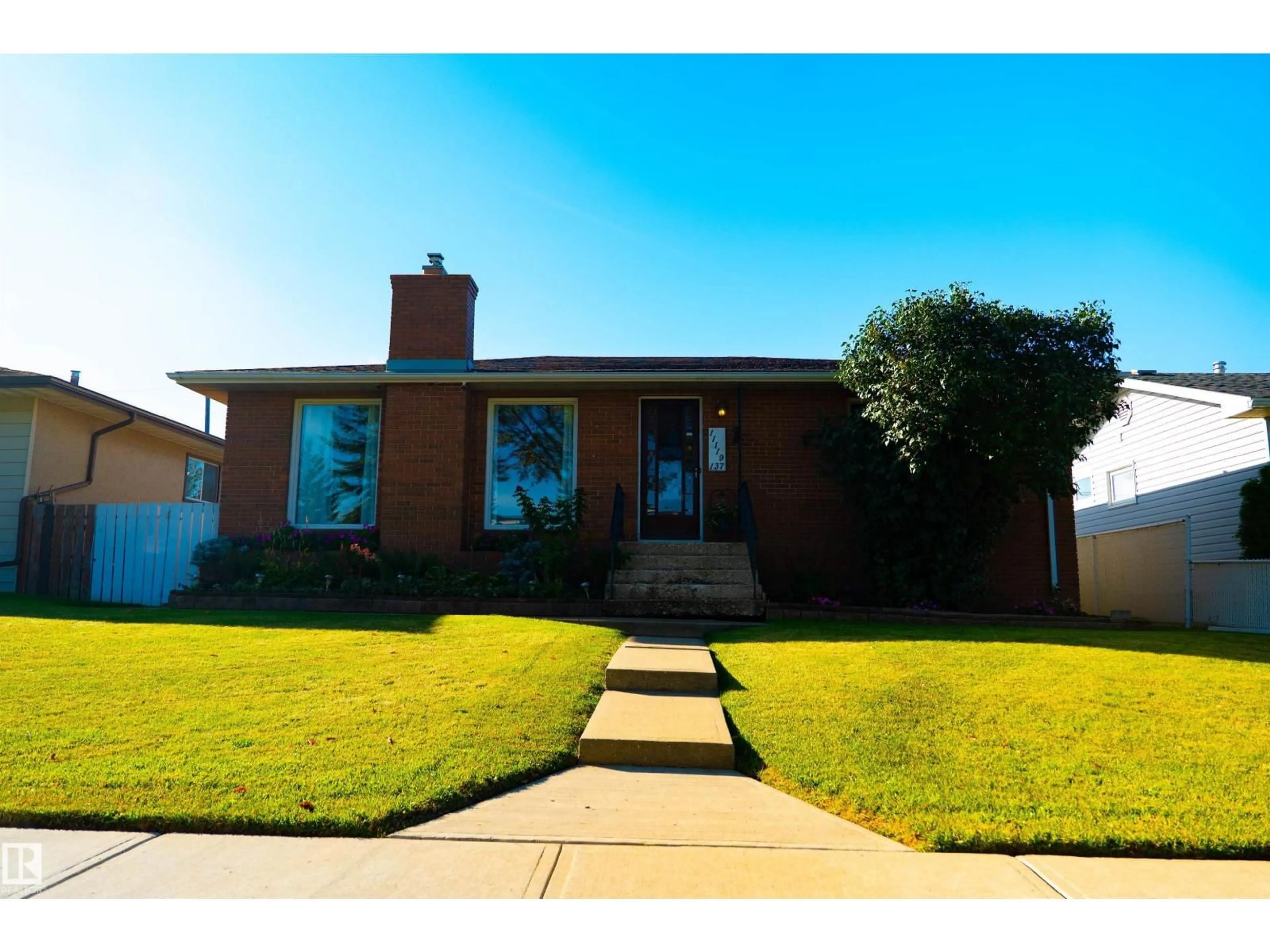 Home with brick exterior material, street for 11119 137 AV, Edmonton Alberta T5E1Z3