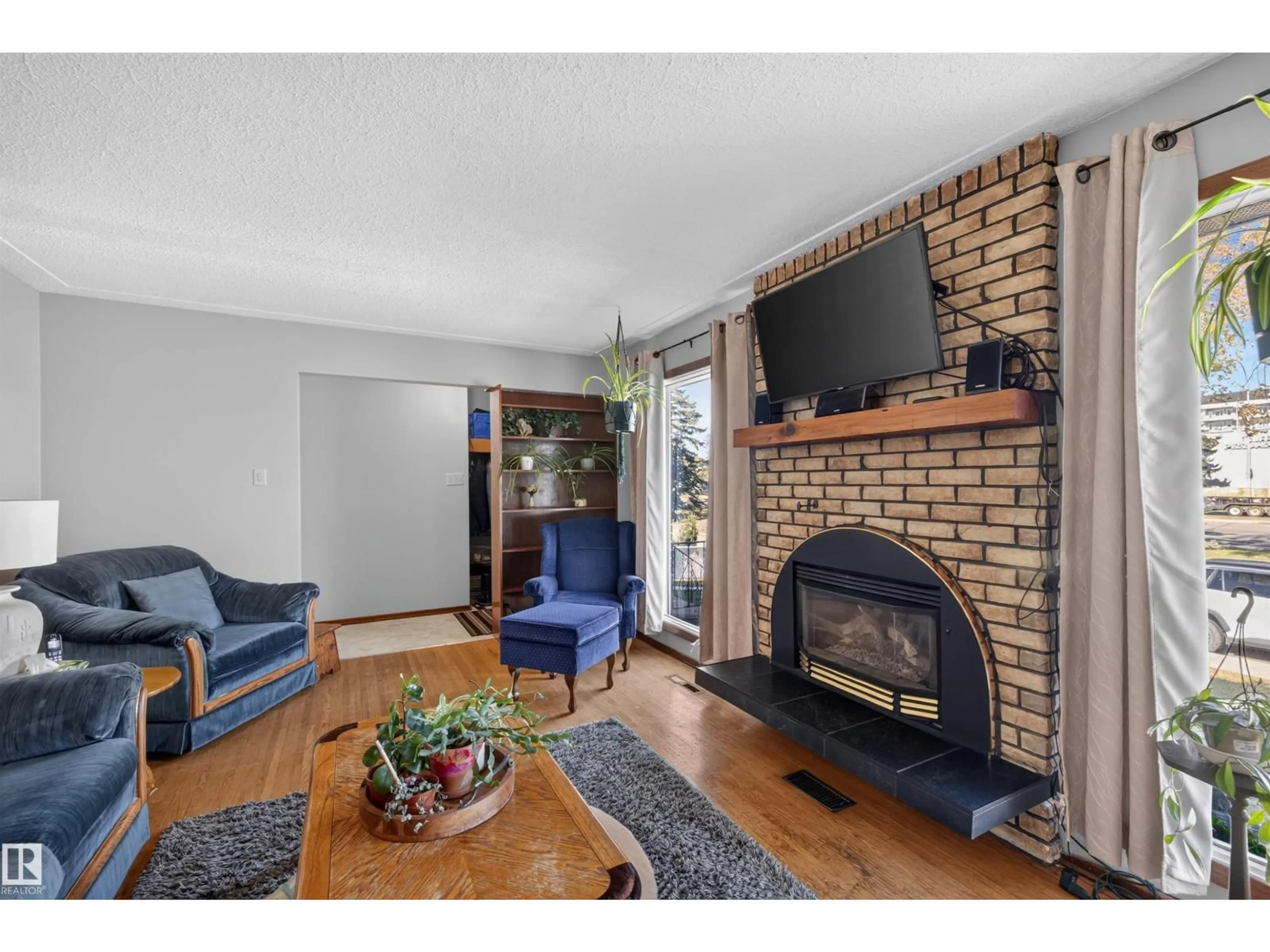 Living room with furniture, unknown for 11119 137 AV, Edmonton Alberta T5E1Z3