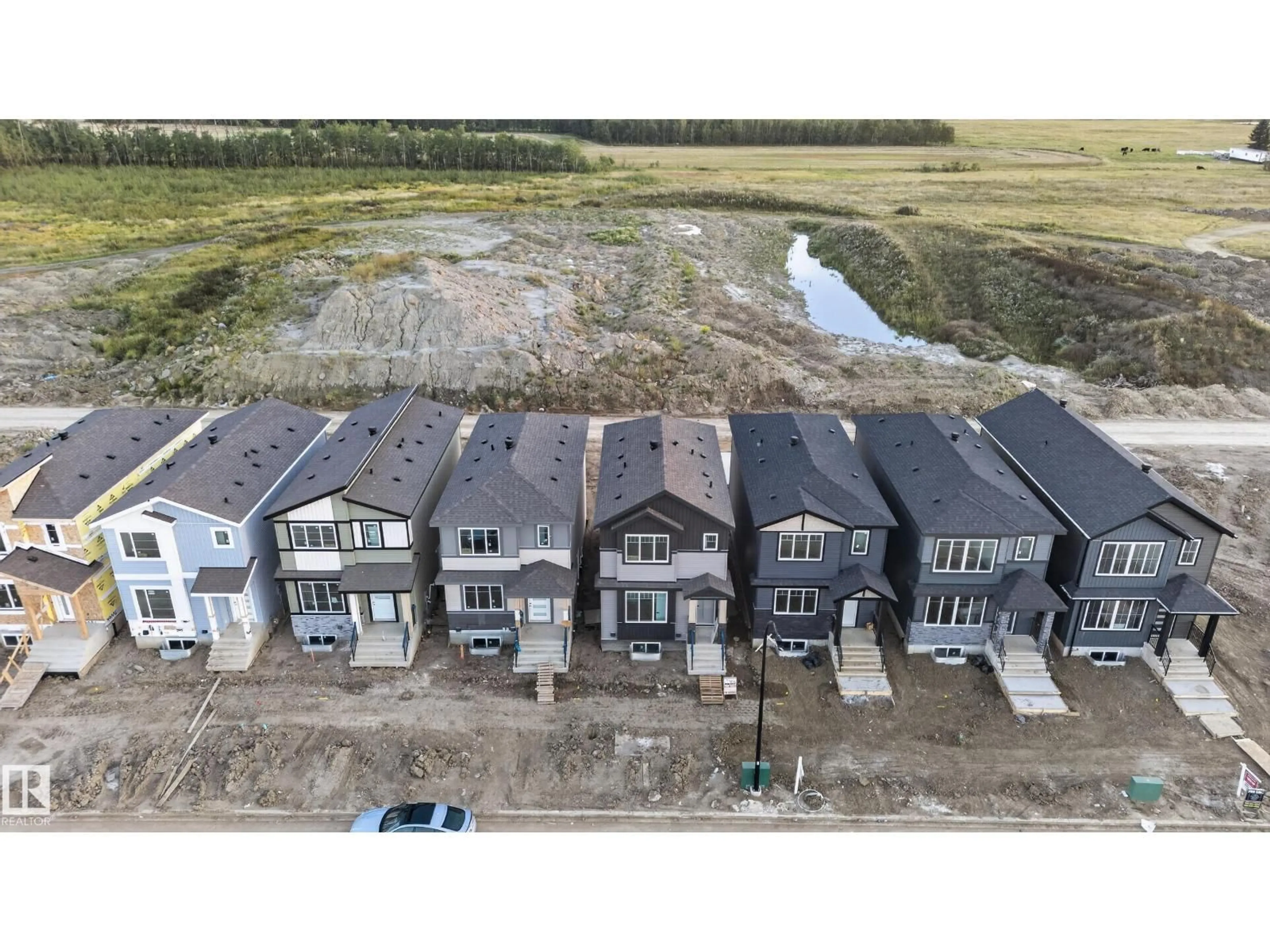 A pic from outside/outdoor area/front of a property/back of a property/a pic from drone, building for 514 ROBINSON BLVD, Leduc Alberta T9E1P8