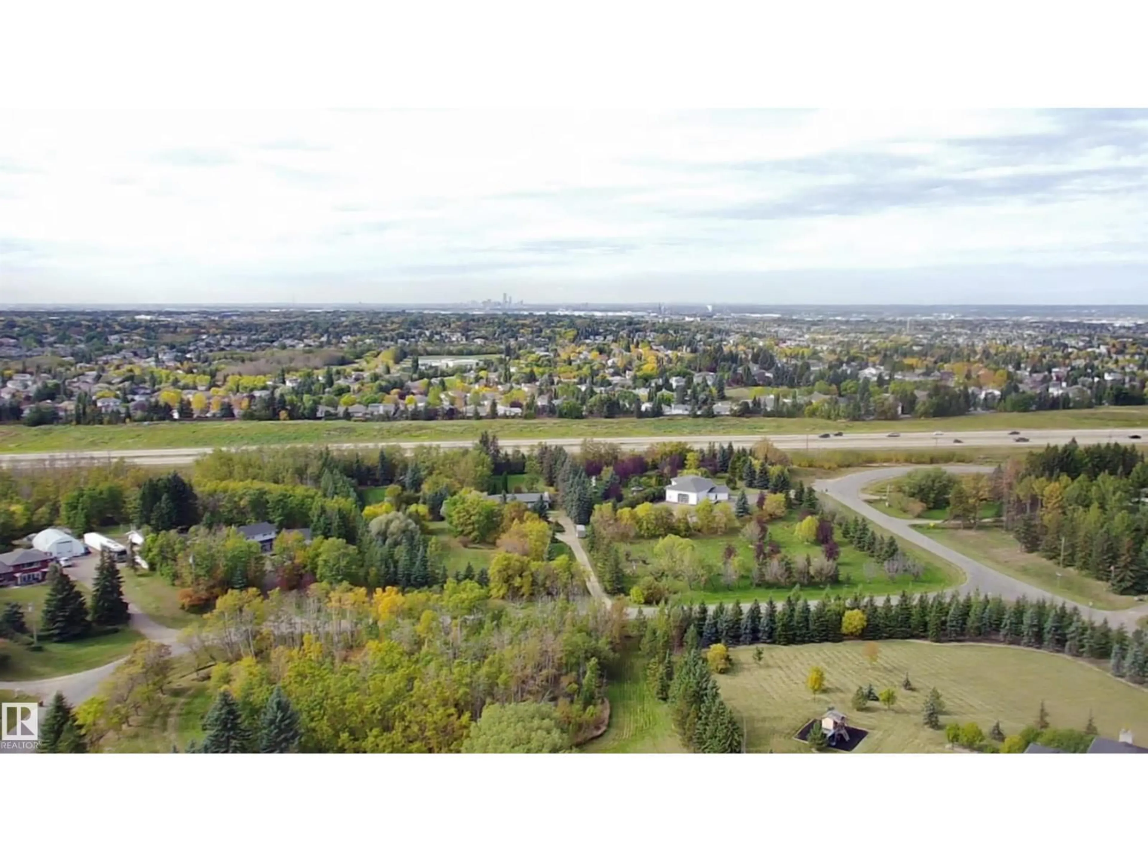A pic from outside/outdoor area/front of a property/back of a property/a pic from drone, unknown for 74 22555 TWP ROAD 530, Rural Strathcona County Alberta T8A4T7