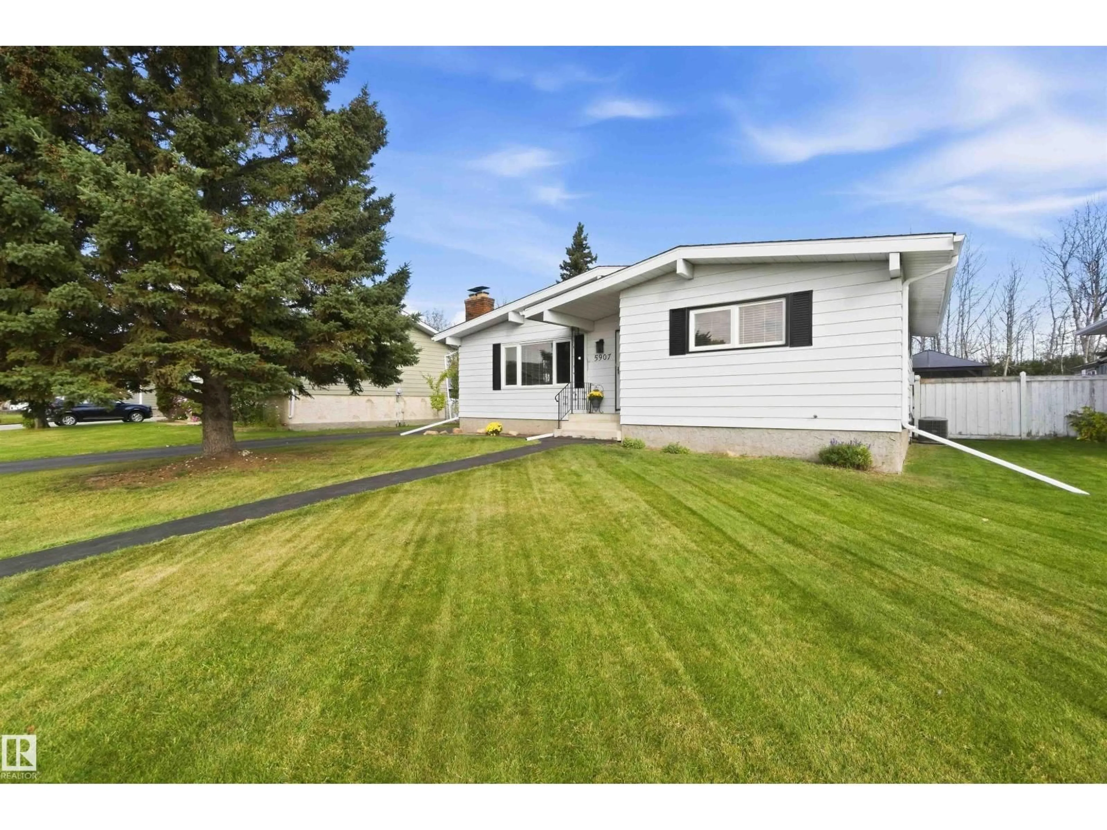 Home with vinyl exterior material, street for 5907 53A AV, Redwater Alberta T0A2W0