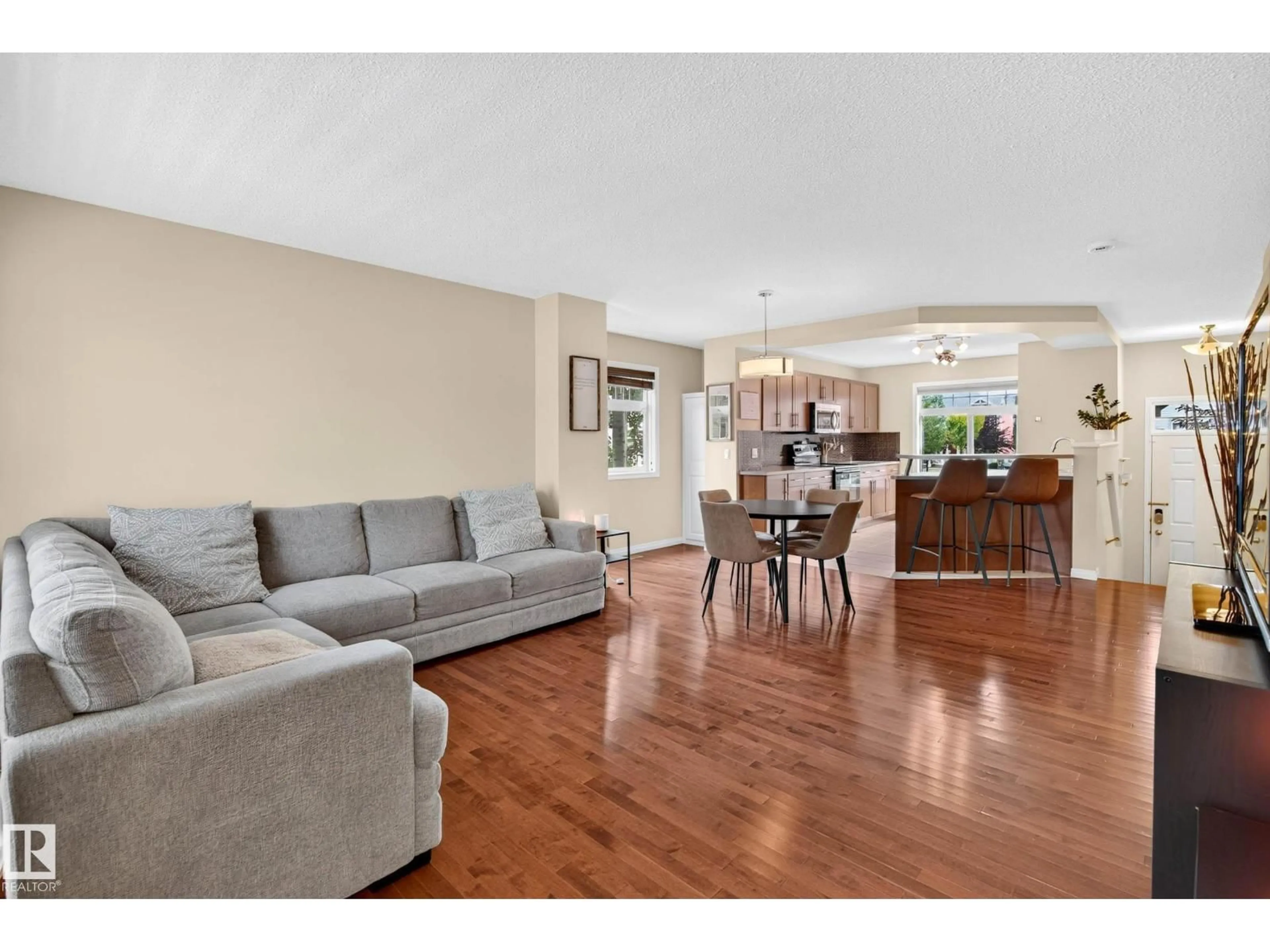Living room with furniture, wood/laminate floor for 465 - 20 HEMINGWAY RD, Edmonton Alberta T6M0J7