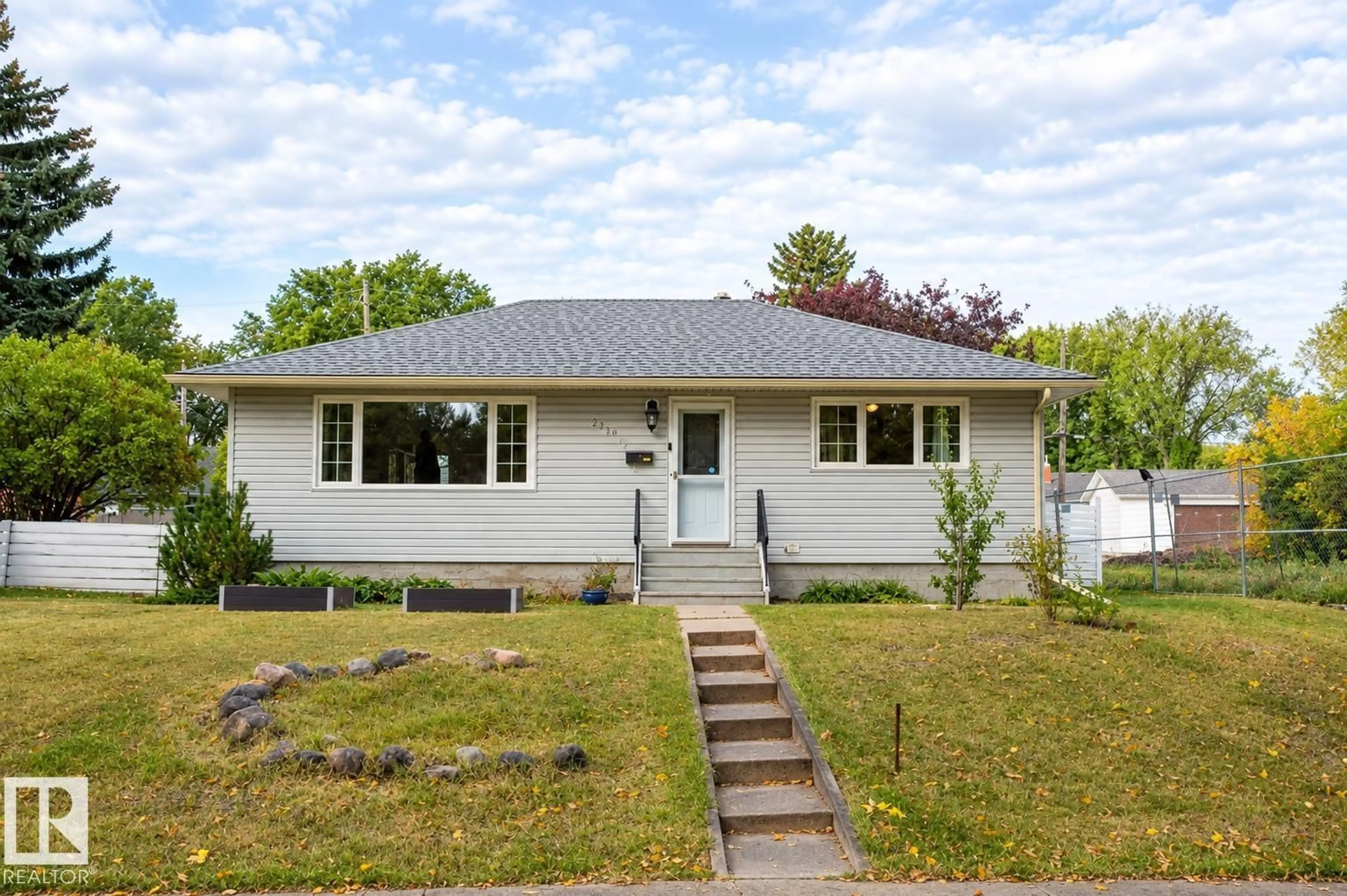 Home with vinyl exterior material, street for 9512 76 ST, Edmonton Alberta T6C2K9