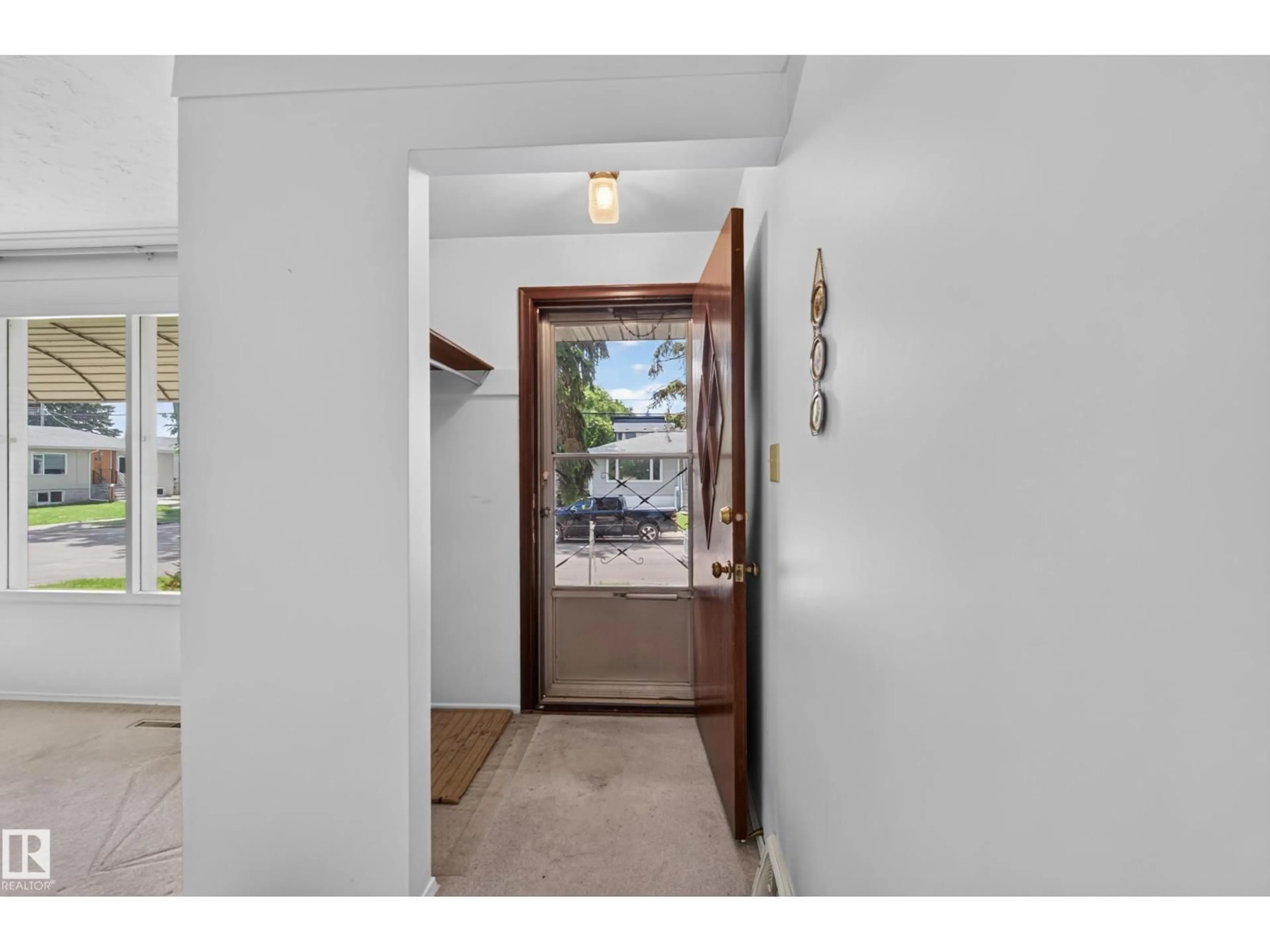 Indoor entryway for 7704 104 AV, Edmonton Alberta T6A0Y3