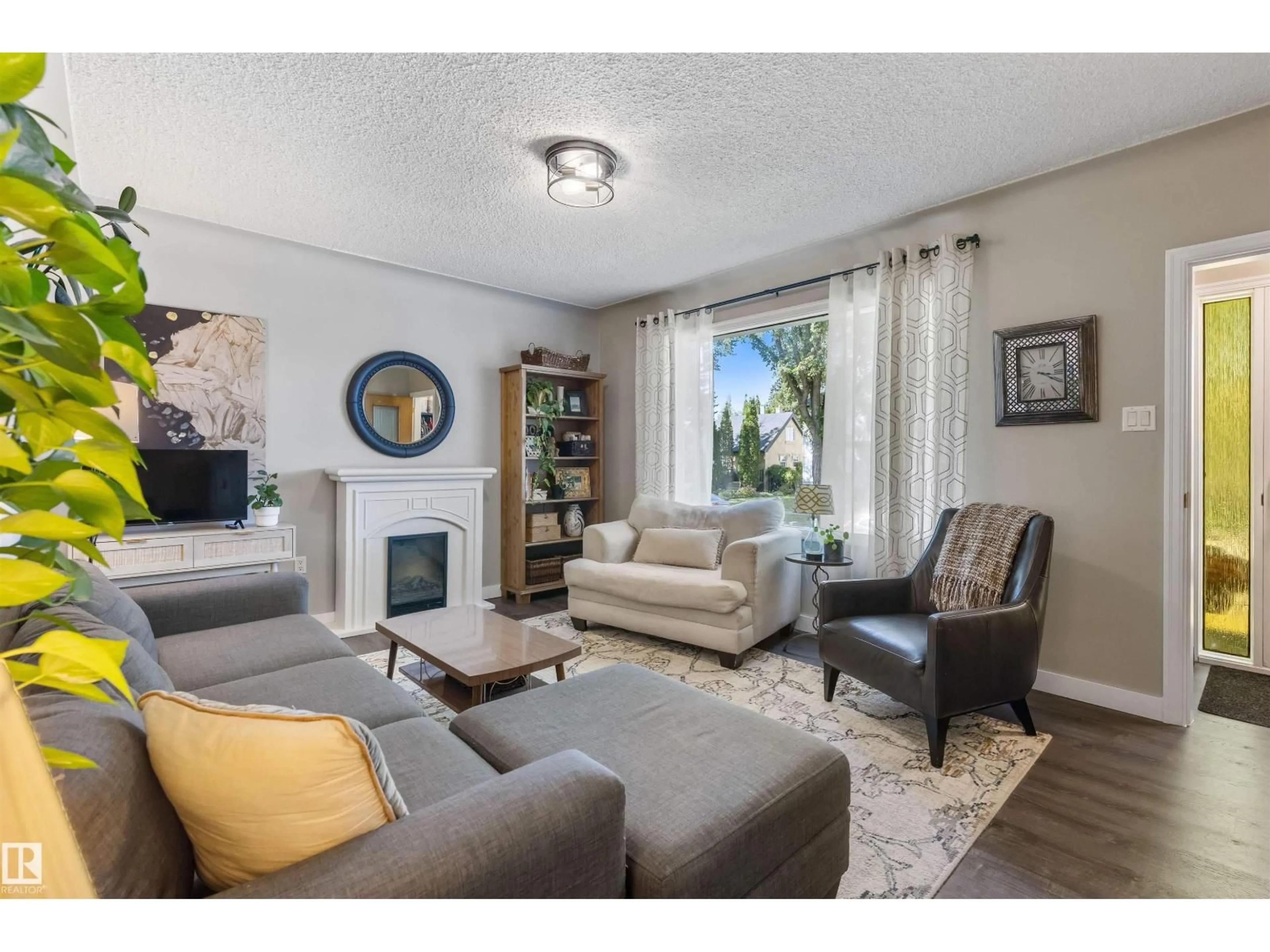 Living room with furniture, unknown for 9715 71 AV, Edmonton Alberta T6E0W5