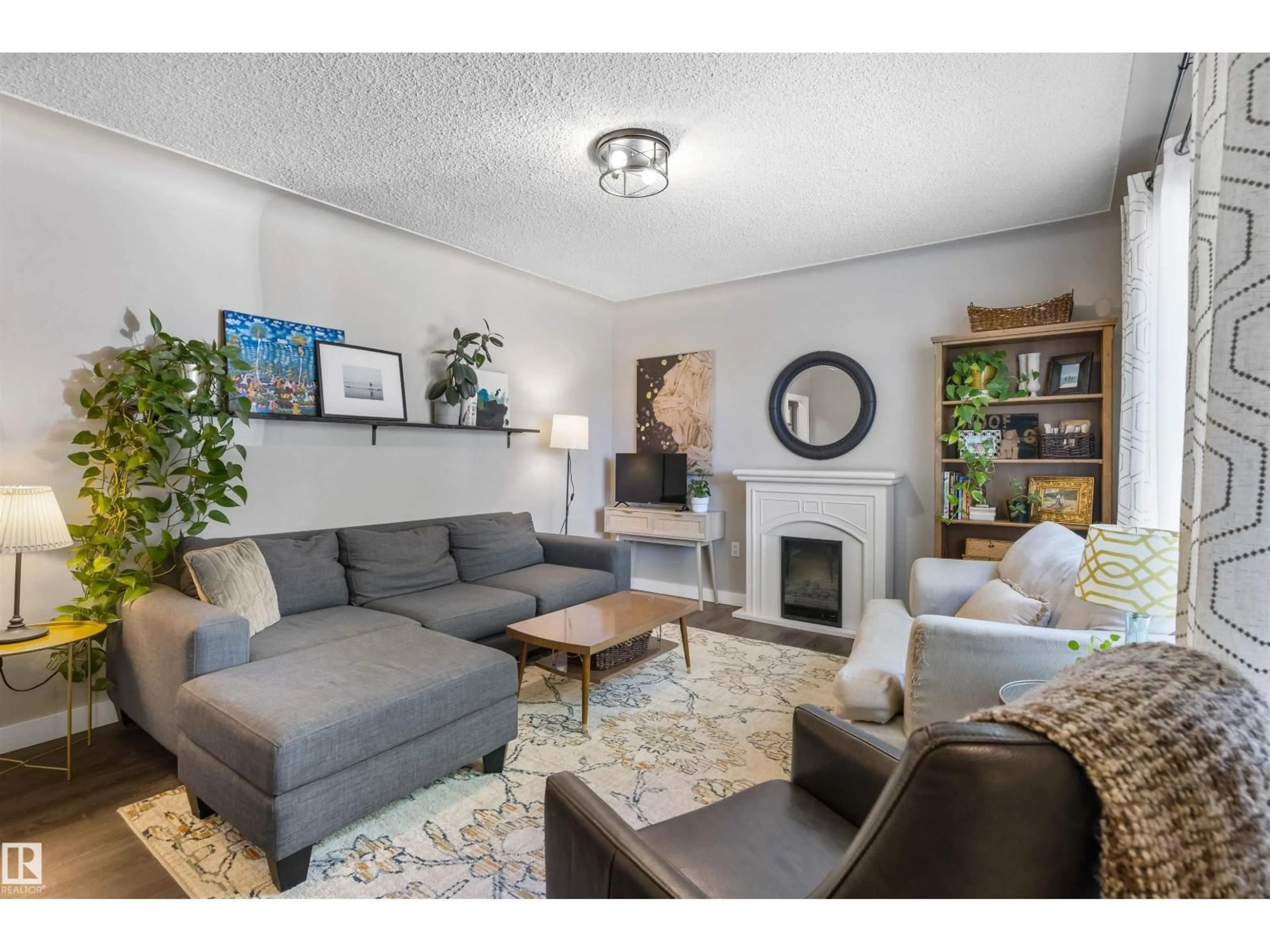 Living room with furniture, unknown for 9715 71 AV, Edmonton Alberta T6E0W5