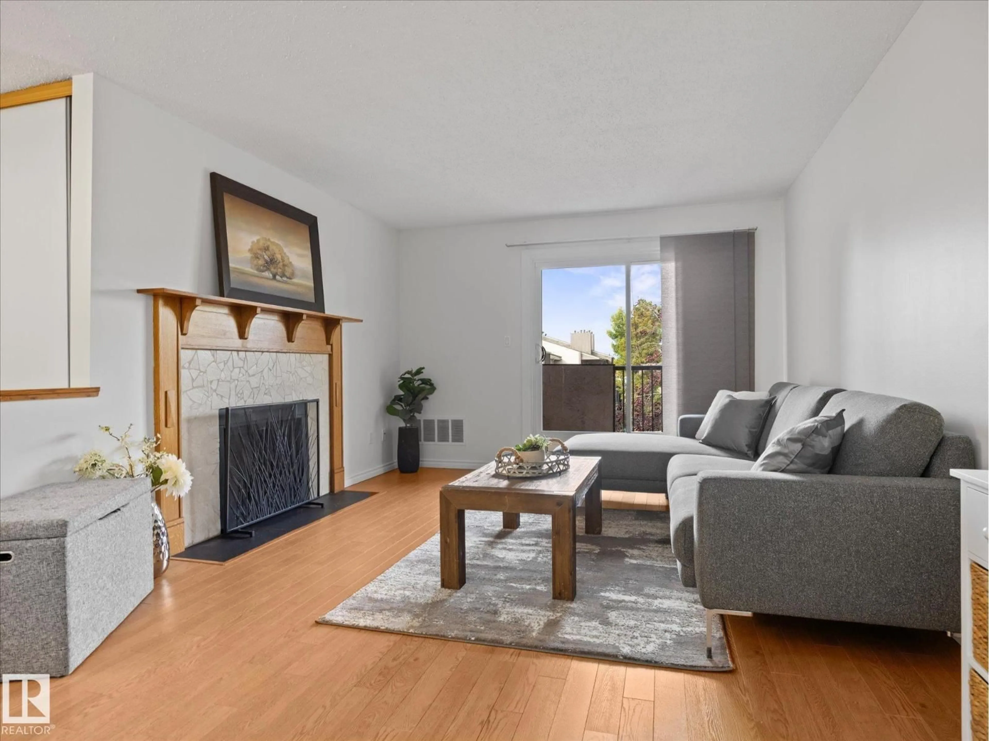 Living room with furniture, wood/laminate floor for 301 AKINS DR, St. Albert Alberta T8N3M6
