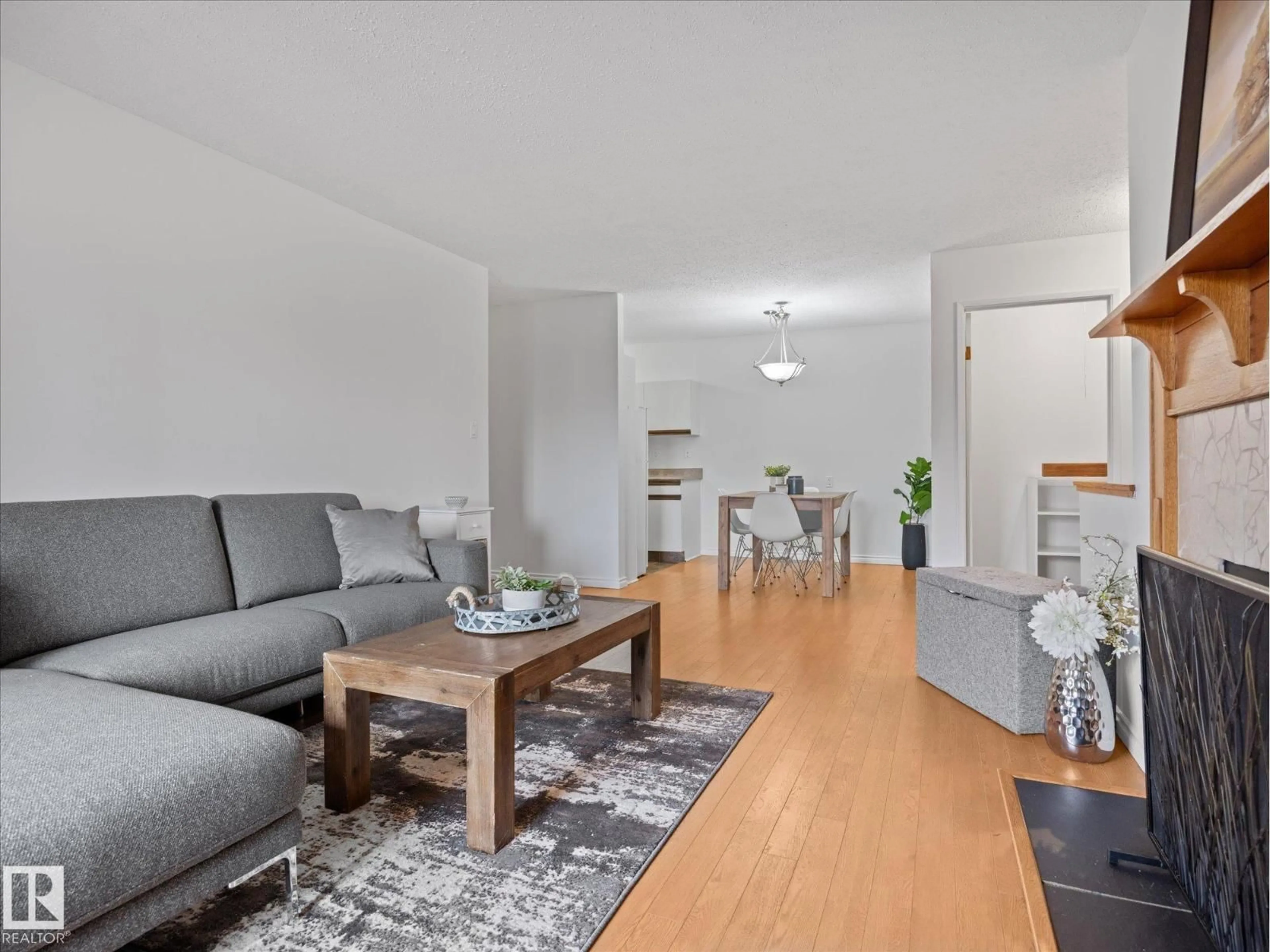Living room with furniture, wood/laminate floor for 301 AKINS DR, St. Albert Alberta T8N3M6