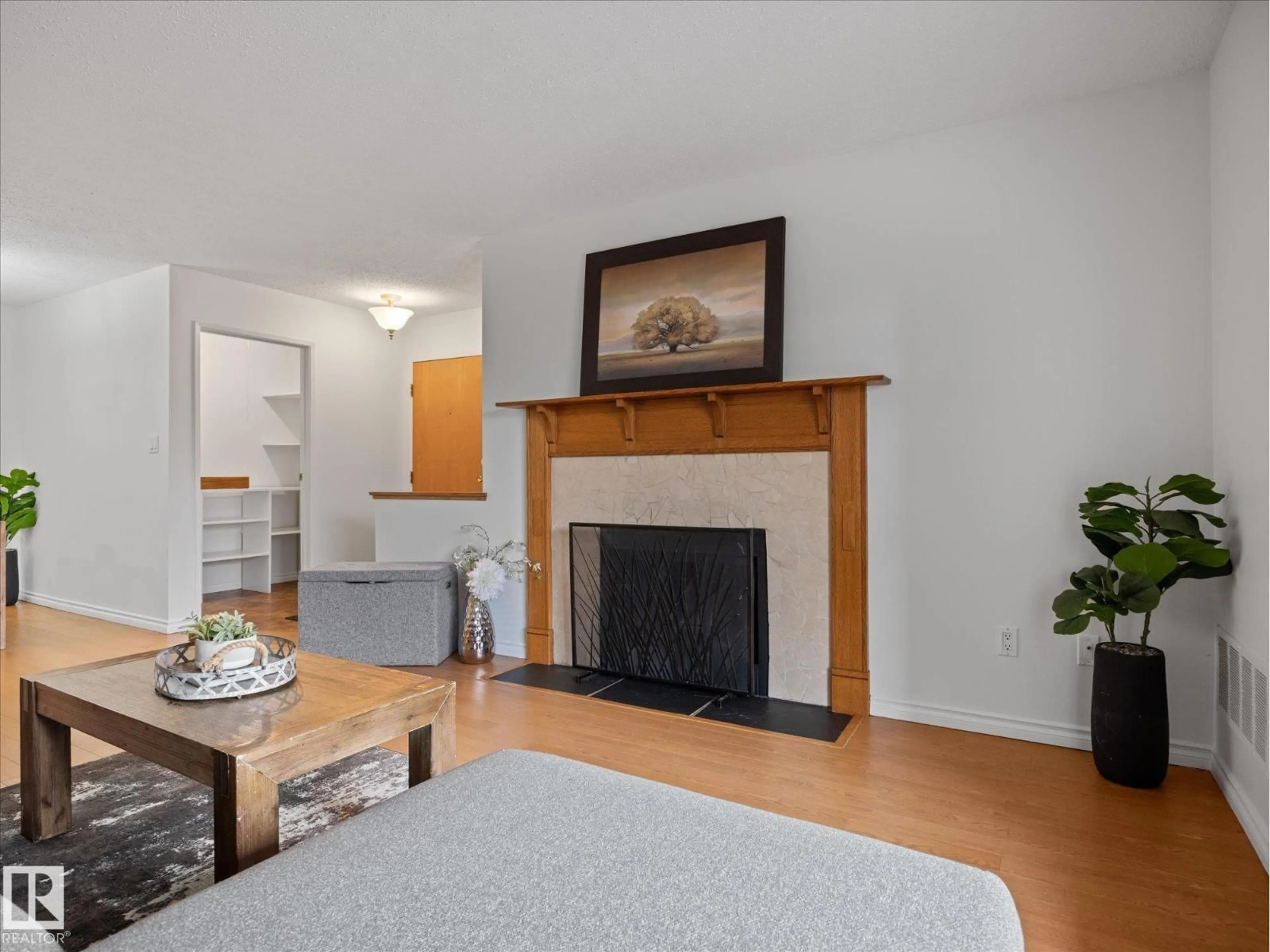 Living room with furniture, wood/laminate floor for 301 AKINS DR, St. Albert Alberta T8N3M6