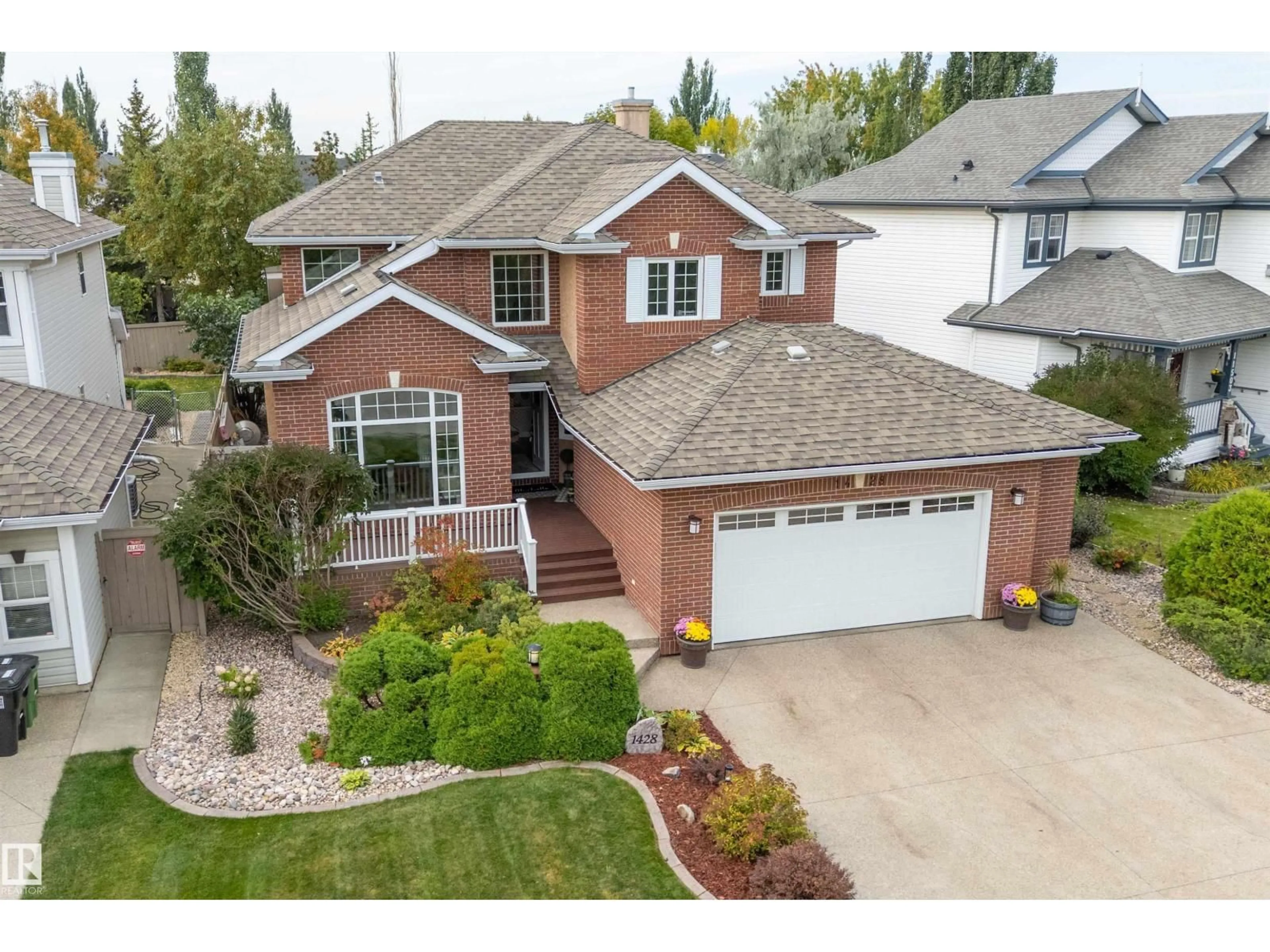 Home with brick exterior material, street for NW - 1428 115 ST, Edmonton Alberta T6J7B8