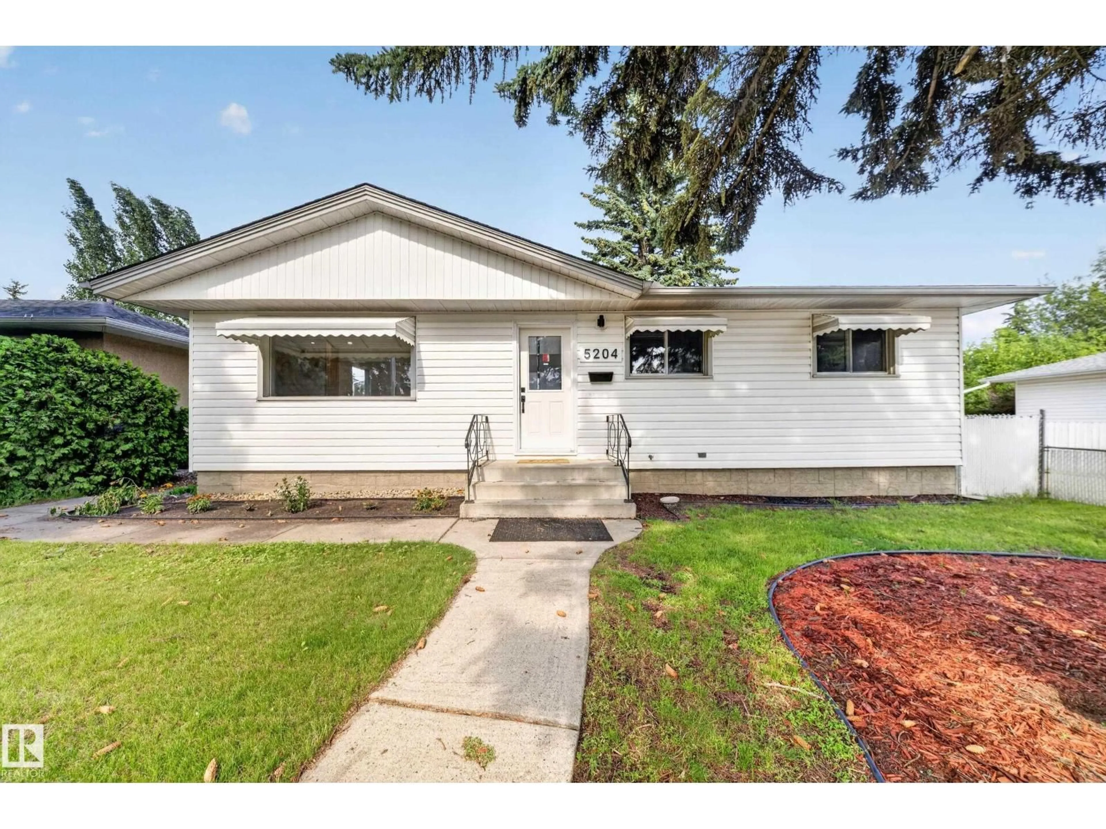 Home with vinyl exterior material, street for NW - 5204 97A AV, Edmonton Alberta T6B1E1