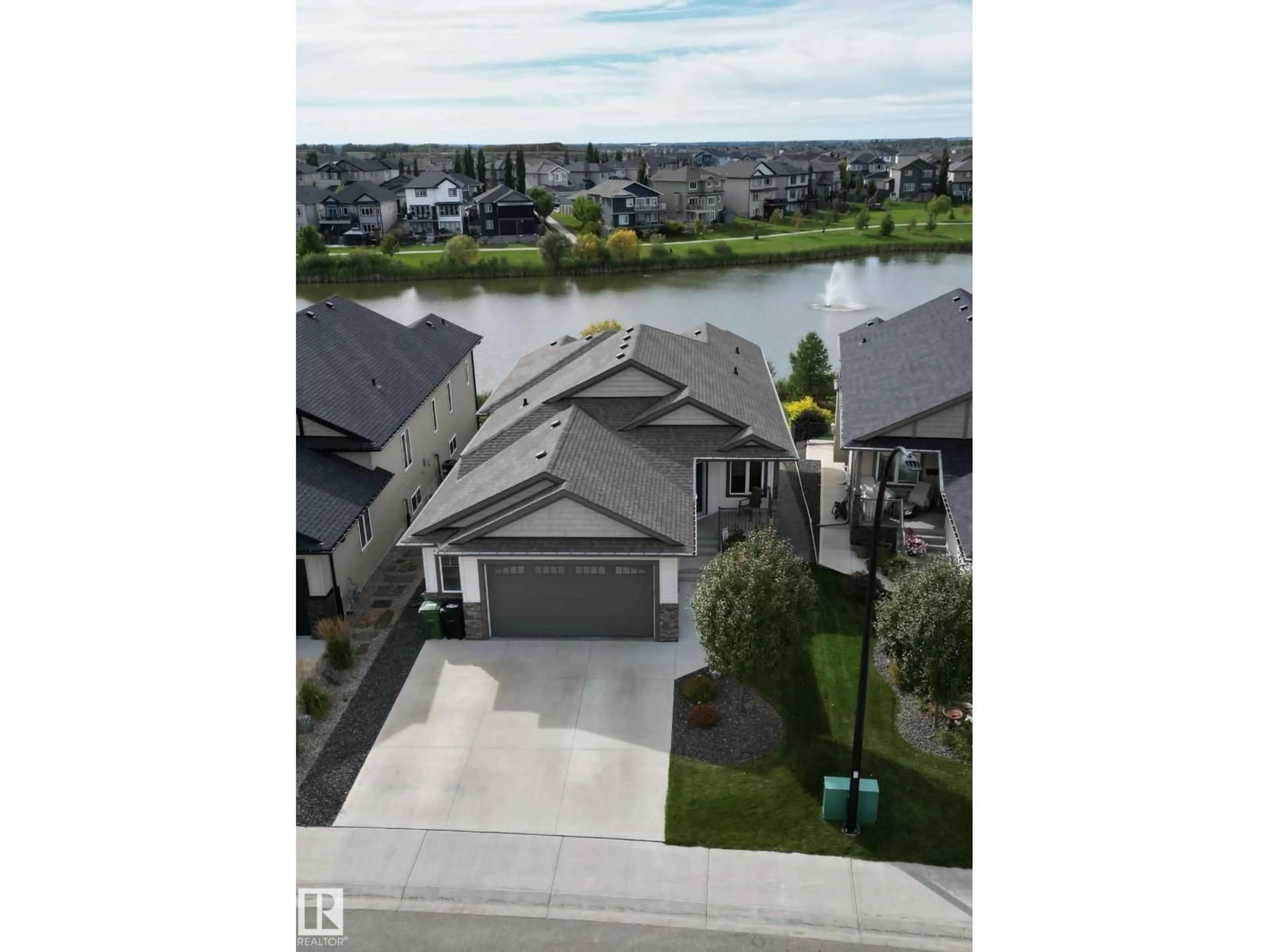 A pic from outside/outdoor area/front of a property/back of a property/a pic from drone, water/lake/river/ocean view for 484 ROBERTS CR, Leduc Alberta T9E1K9
