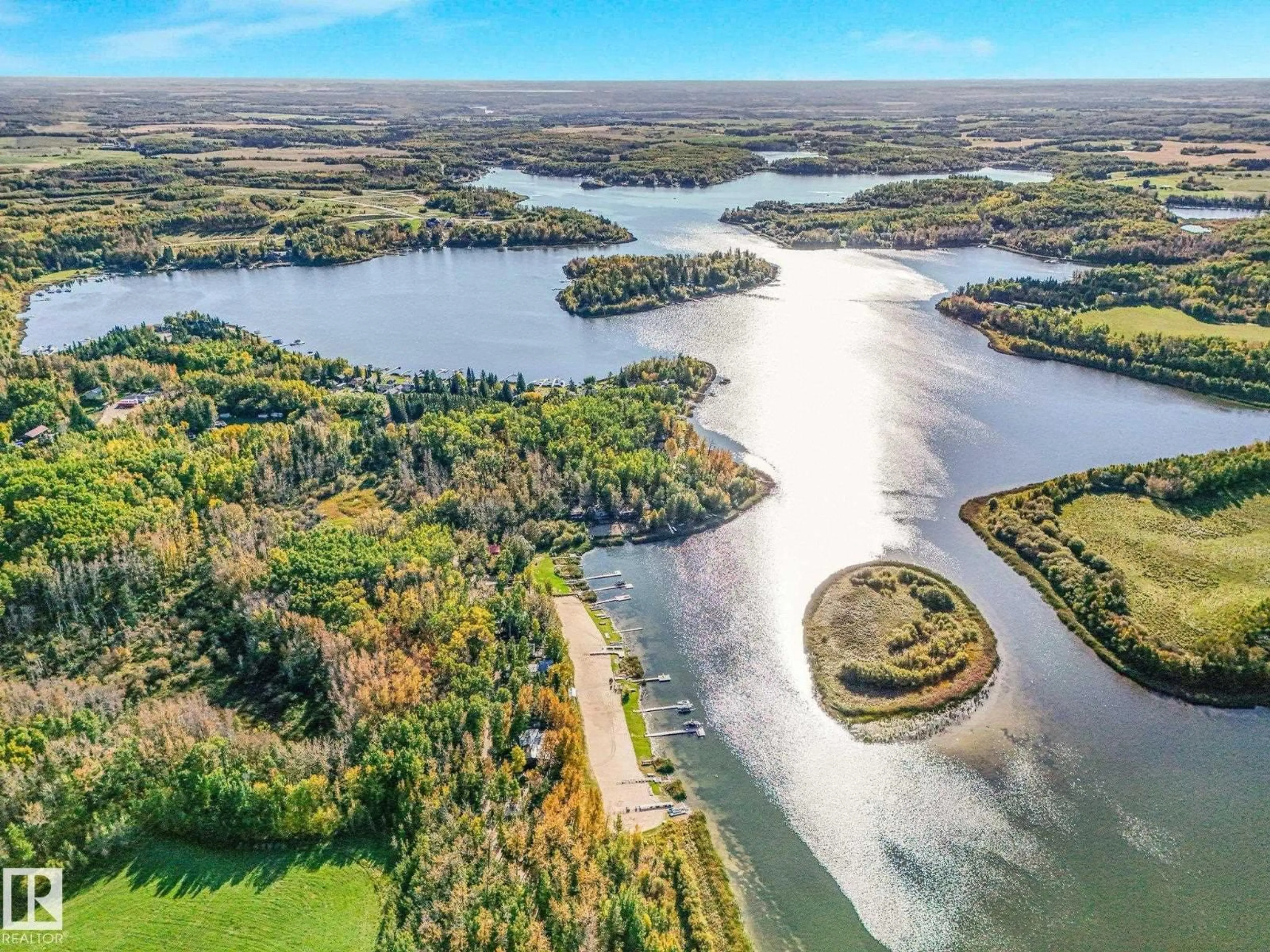 A pic from outside/outdoor area/front of a property/back of a property/a pic from drone, water/lake/river/ocean view for 52220 HWY 770, Rural Parkland County Alberta T0E0H0