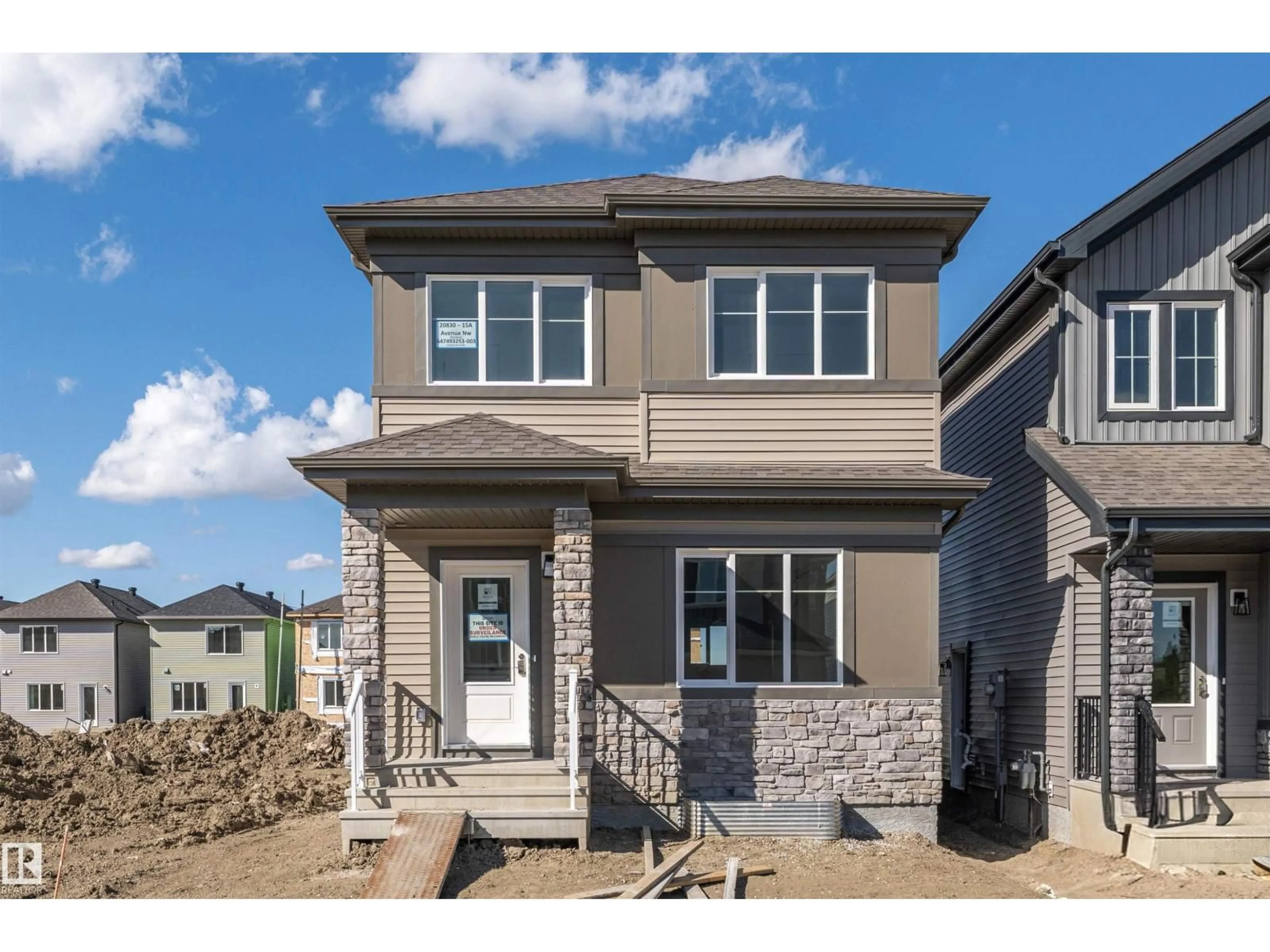 Home with vinyl exterior material, street for 20830 15A AV, Edmonton Alberta T6M3N8
