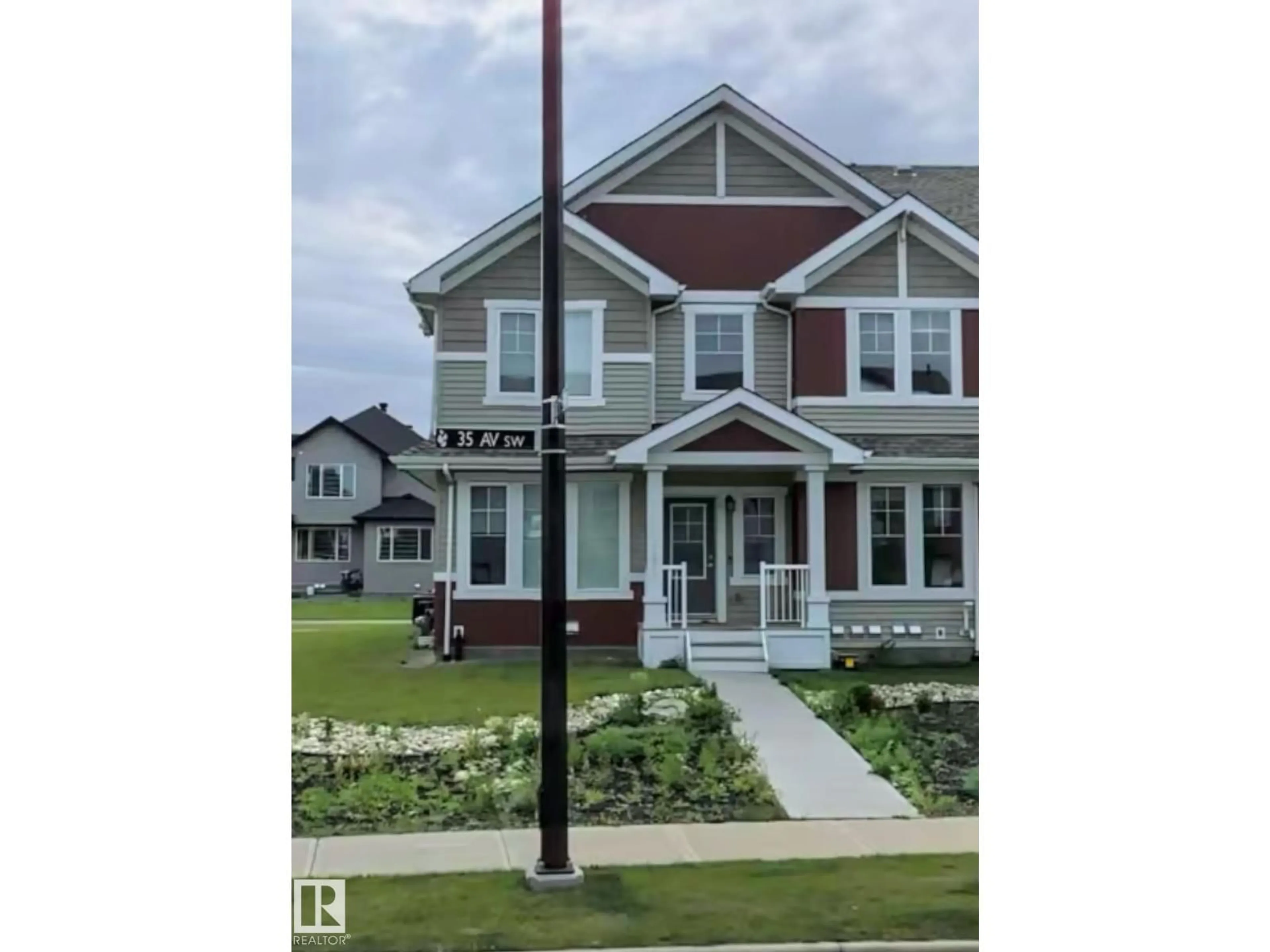 Home with vinyl exterior material, street for SW - 11915 35 AV, Edmonton Alberta T6W4N3