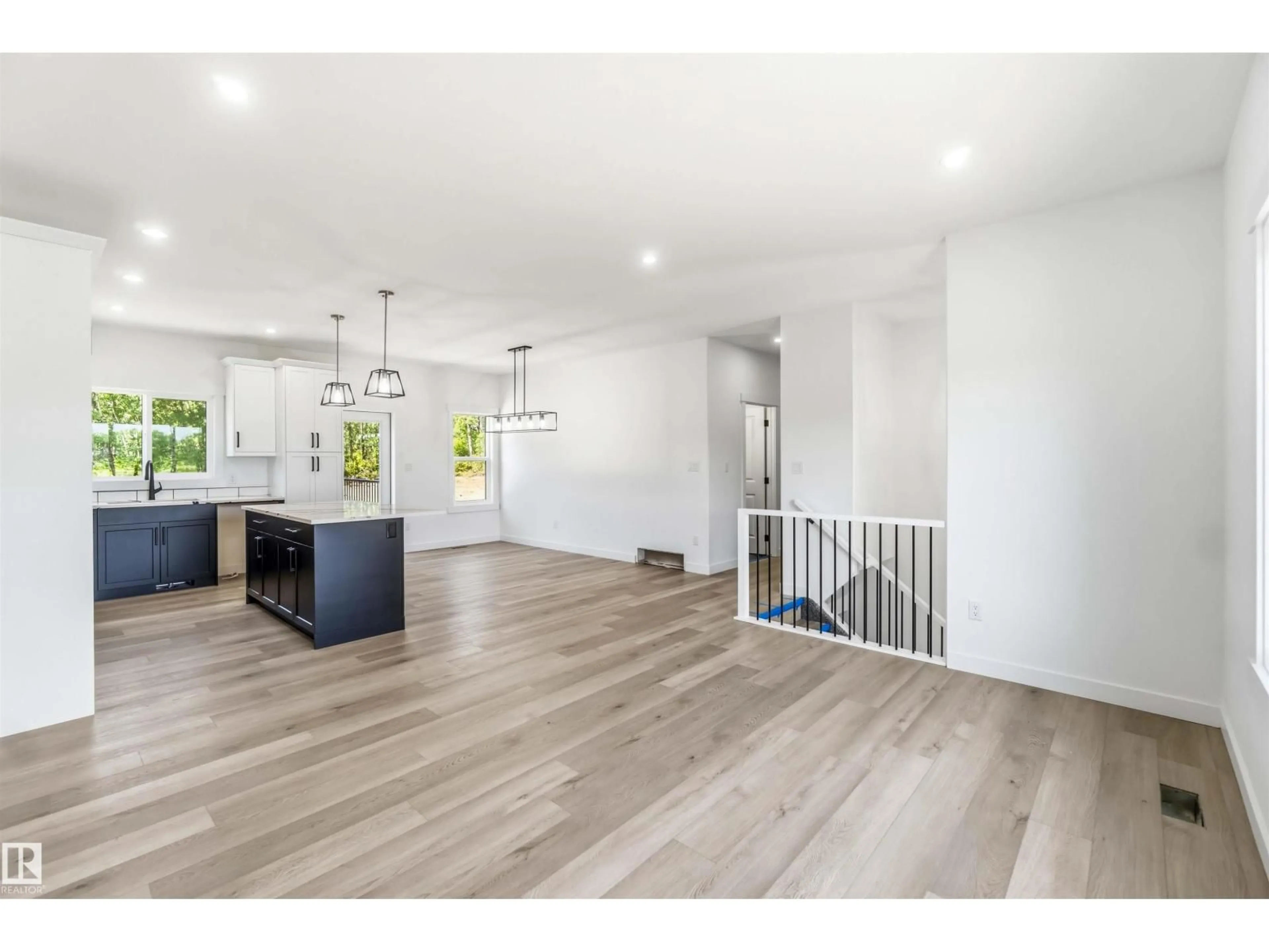 Open concept kitchen, wood/laminate floor for 115 - 3406 TWP ROAD 552, Rural Lac Ste. Anne County Alberta T0E1A0