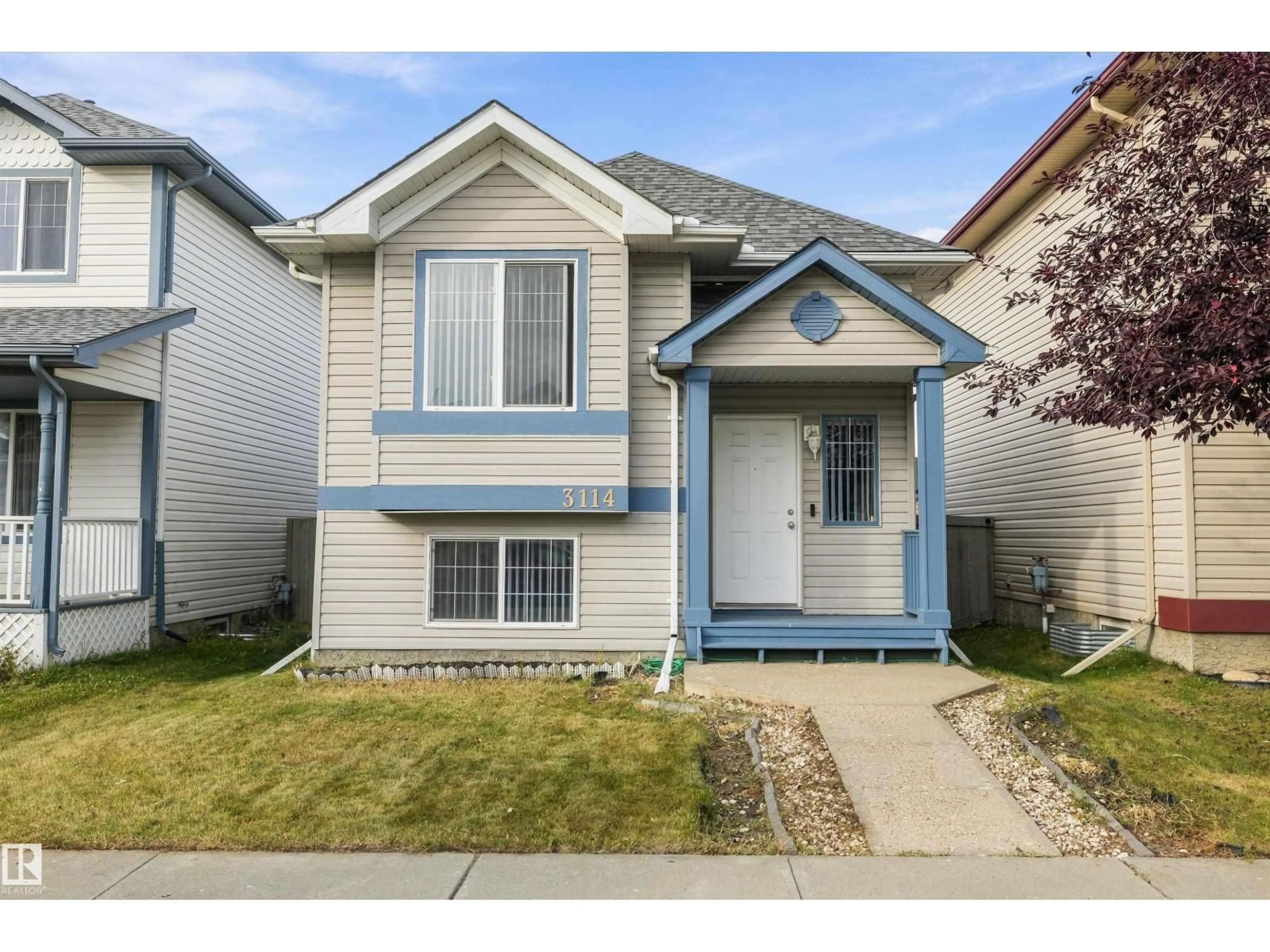 Home with vinyl exterior material, street for 3114 32 AV NW, Edmonton Alberta T6T1X3