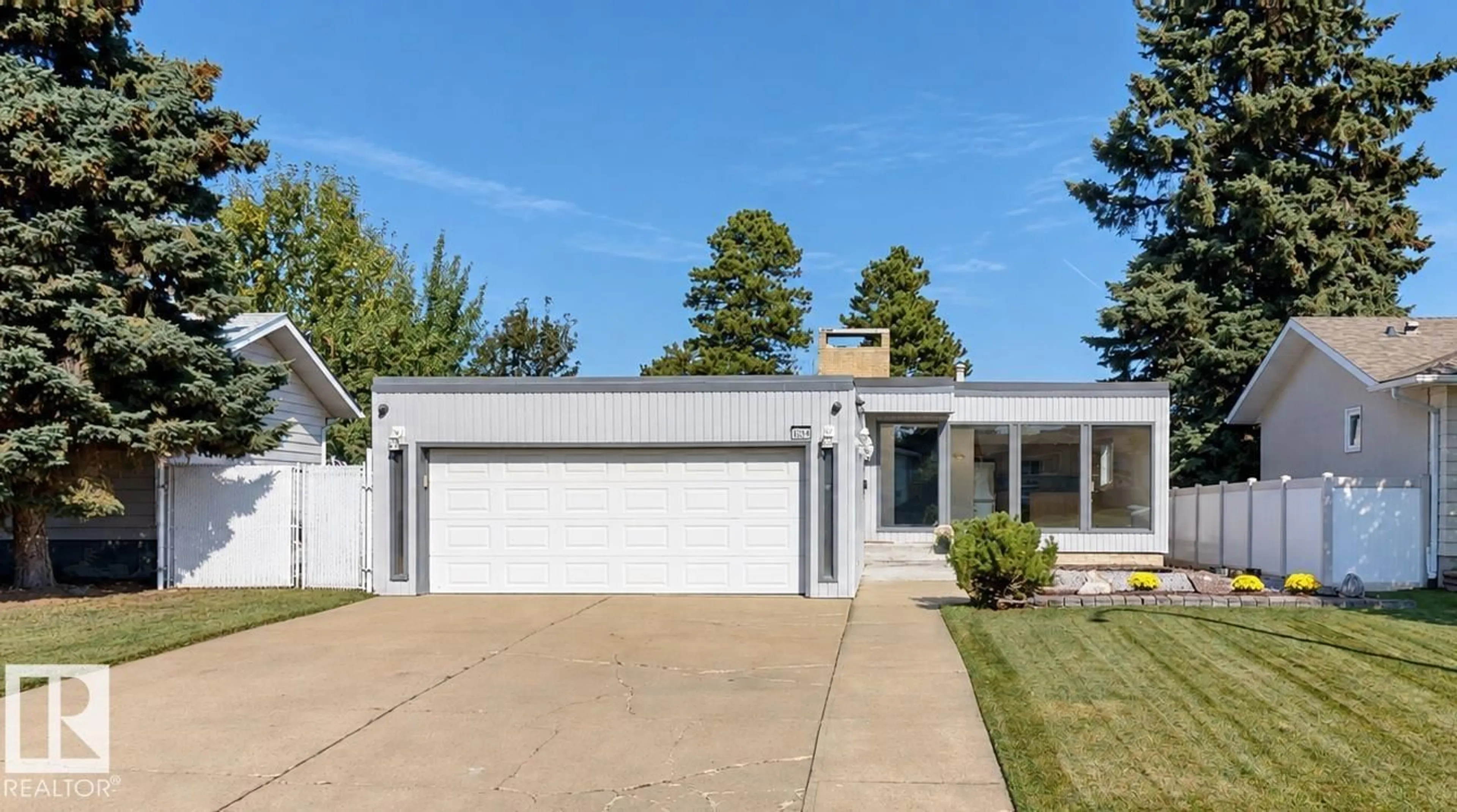 Home with vinyl exterior material, street for 8204 14 AV, Edmonton Alberta T6K1X4