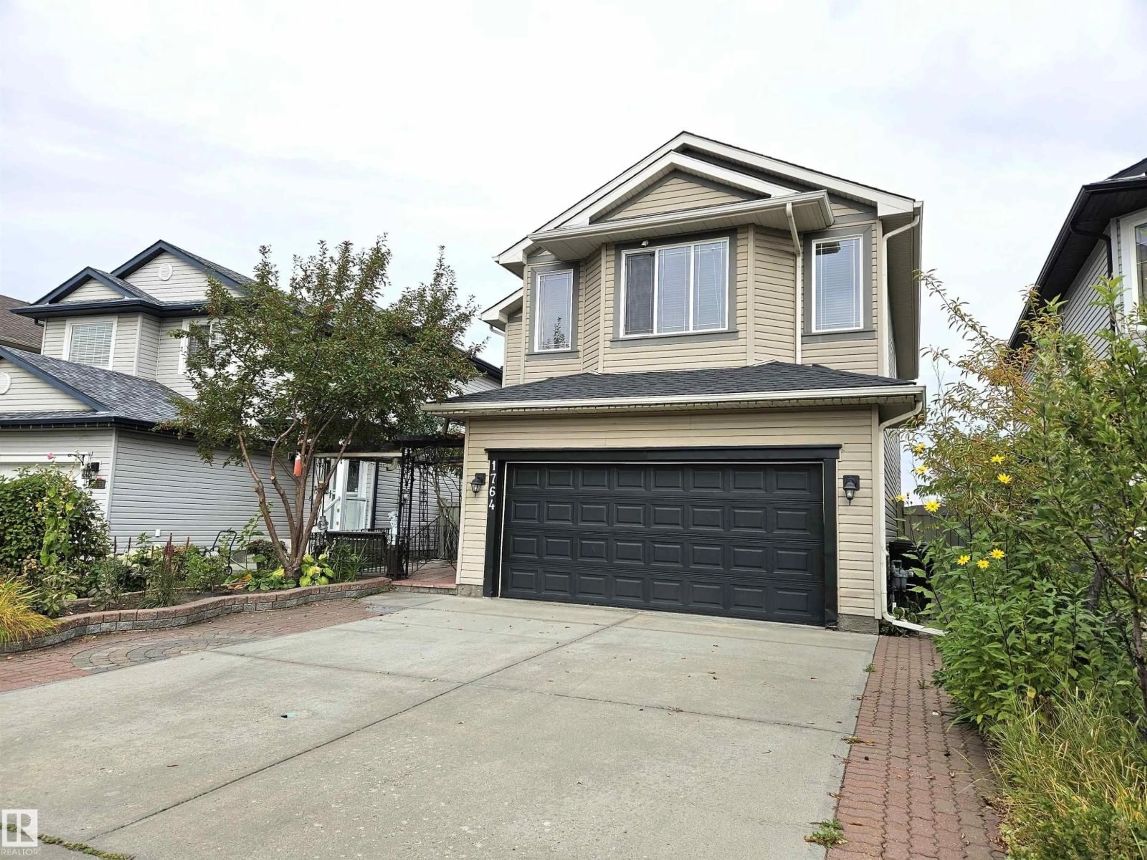 Home with vinyl exterior material, street for 1764 MELROSE CR, Edmonton Alberta T6W0A2