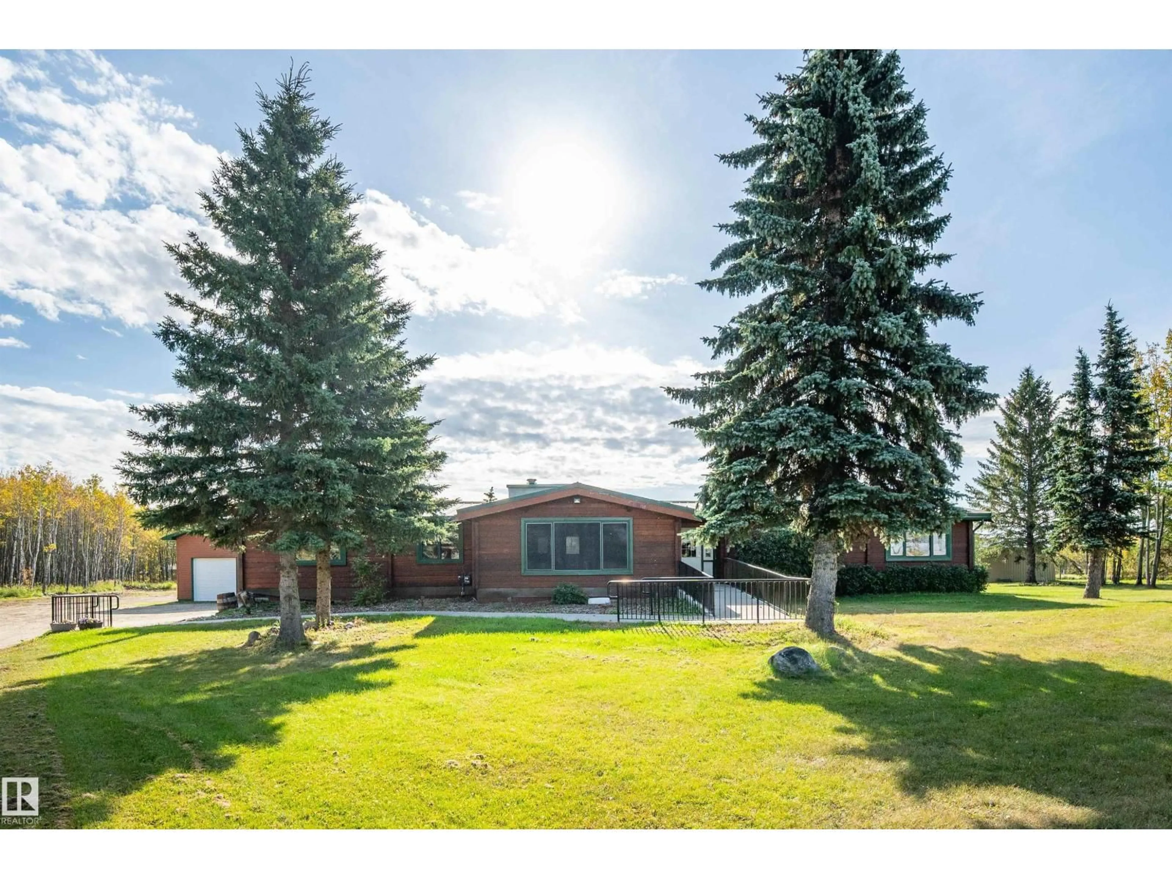 A pic from outside/outdoor area/front of a property/back of a property/a pic from drone, mountain view for 97 - 52307 RGE ROAD 213, Rural Strathcona County Alberta T8G1C1