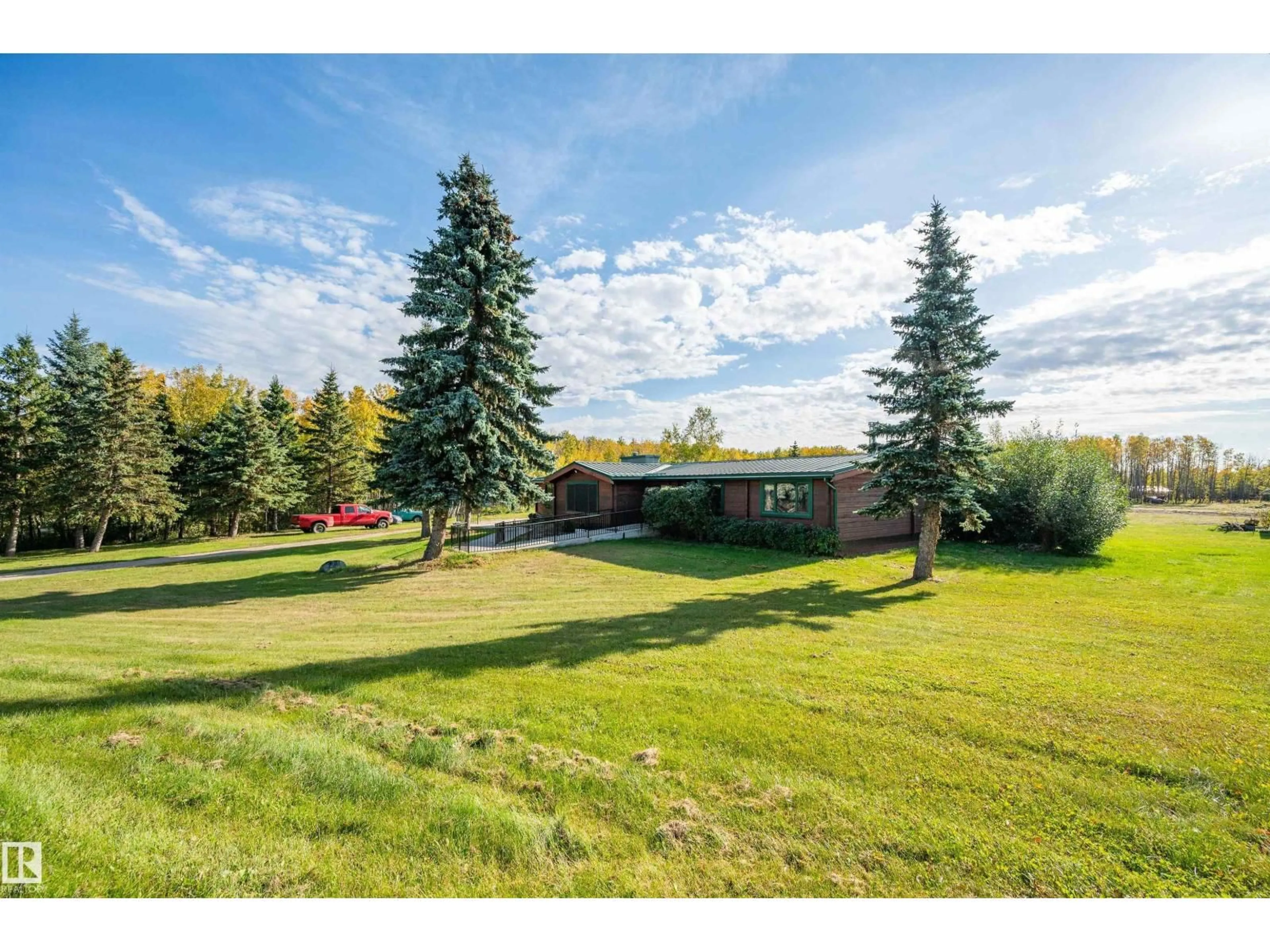 A pic from outside/outdoor area/front of a property/back of a property/a pic from drone, mountain view for 97 - 52307 RGE ROAD 213, Rural Strathcona County Alberta T8G1C1