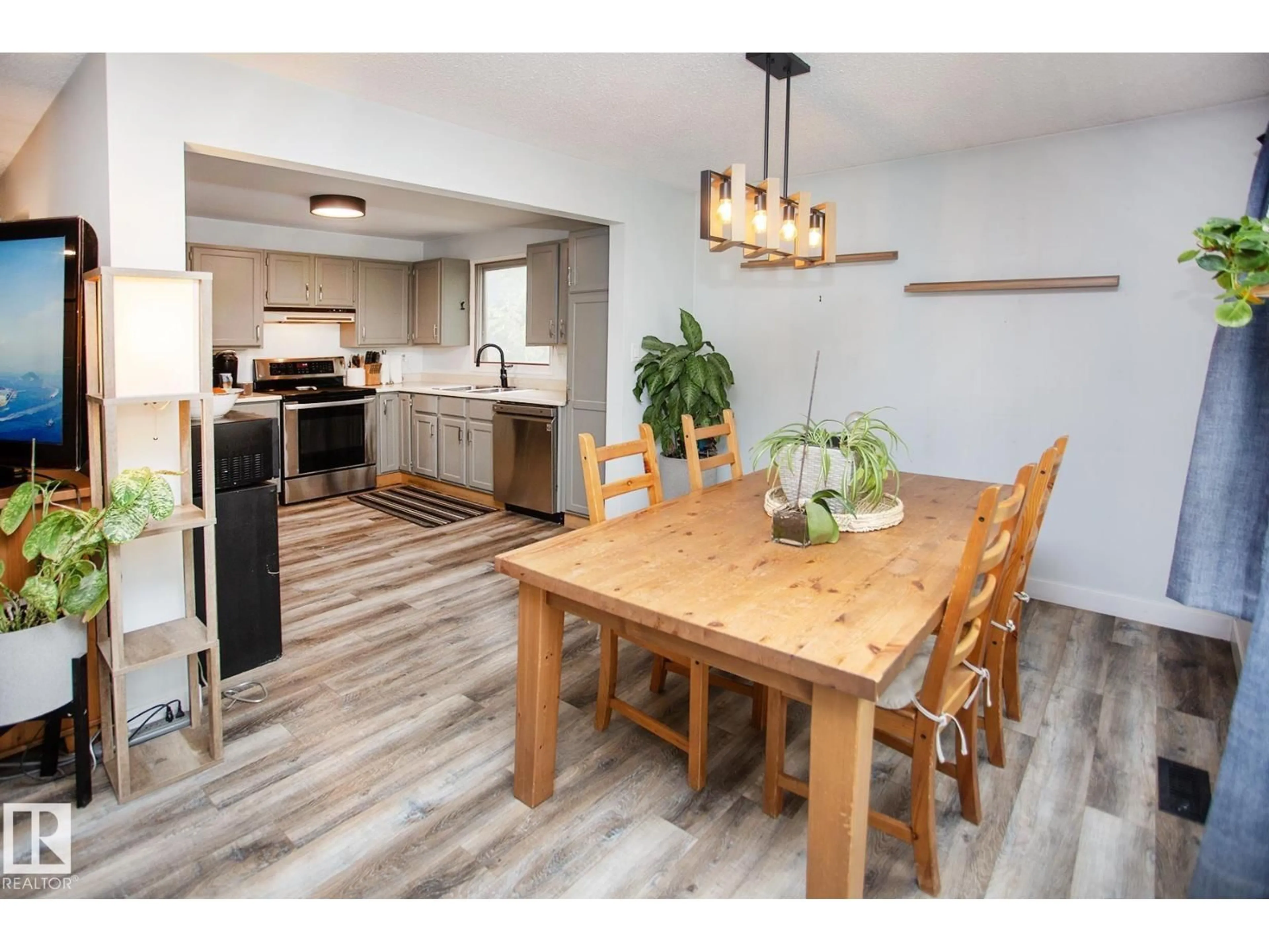 Open concept kitchen, wood/laminate floor for 8 ASH CR, St. Albert Alberta T8N3J3