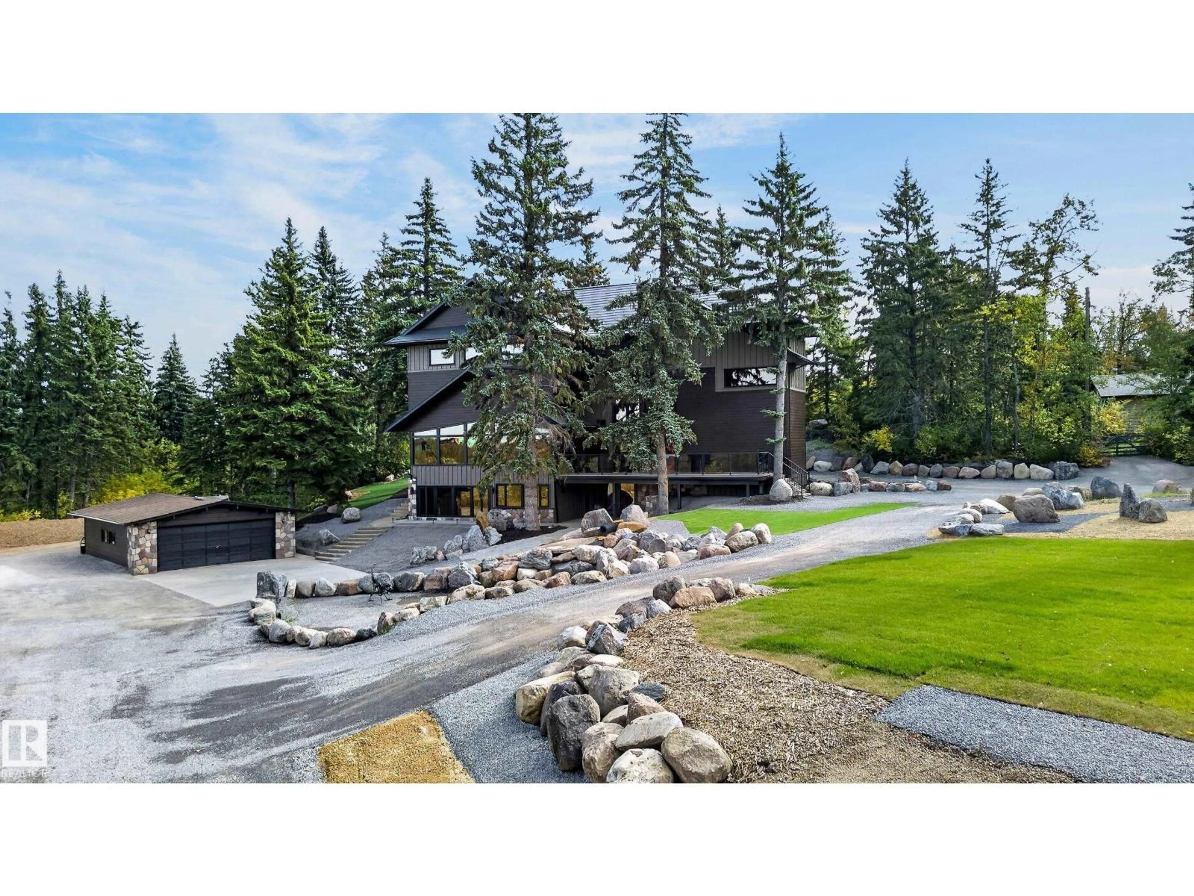 A pic from outside/outdoor area/front of a property/back of a property/a pic from drone, mountain view for 277 52313 RGE ROAD 232, Rural Strathcona County Alberta T8B1C6