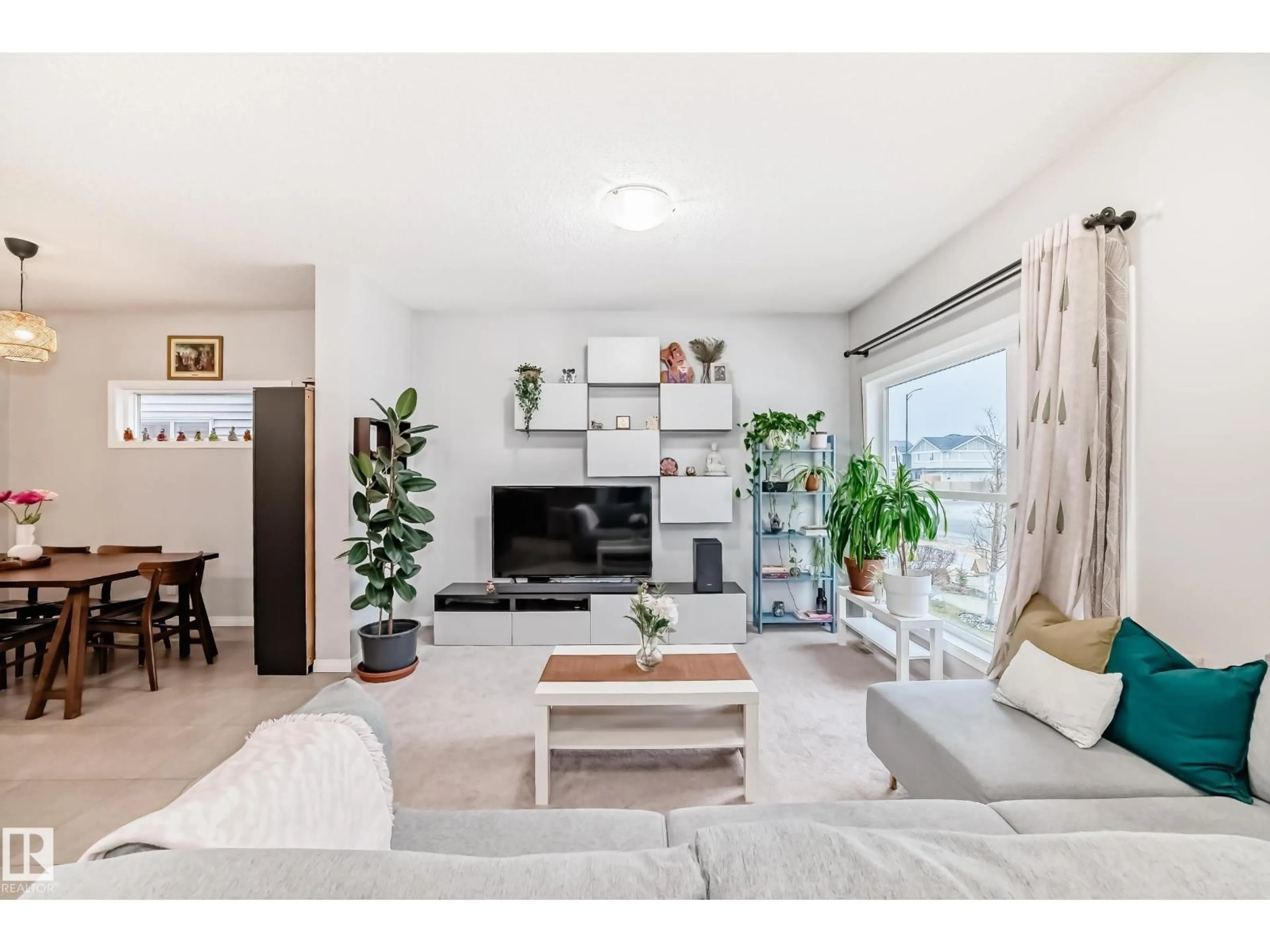 Living room with furniture, wood/laminate floor for 2008 CAVANAGH DR, Edmonton Alberta T6W3M6