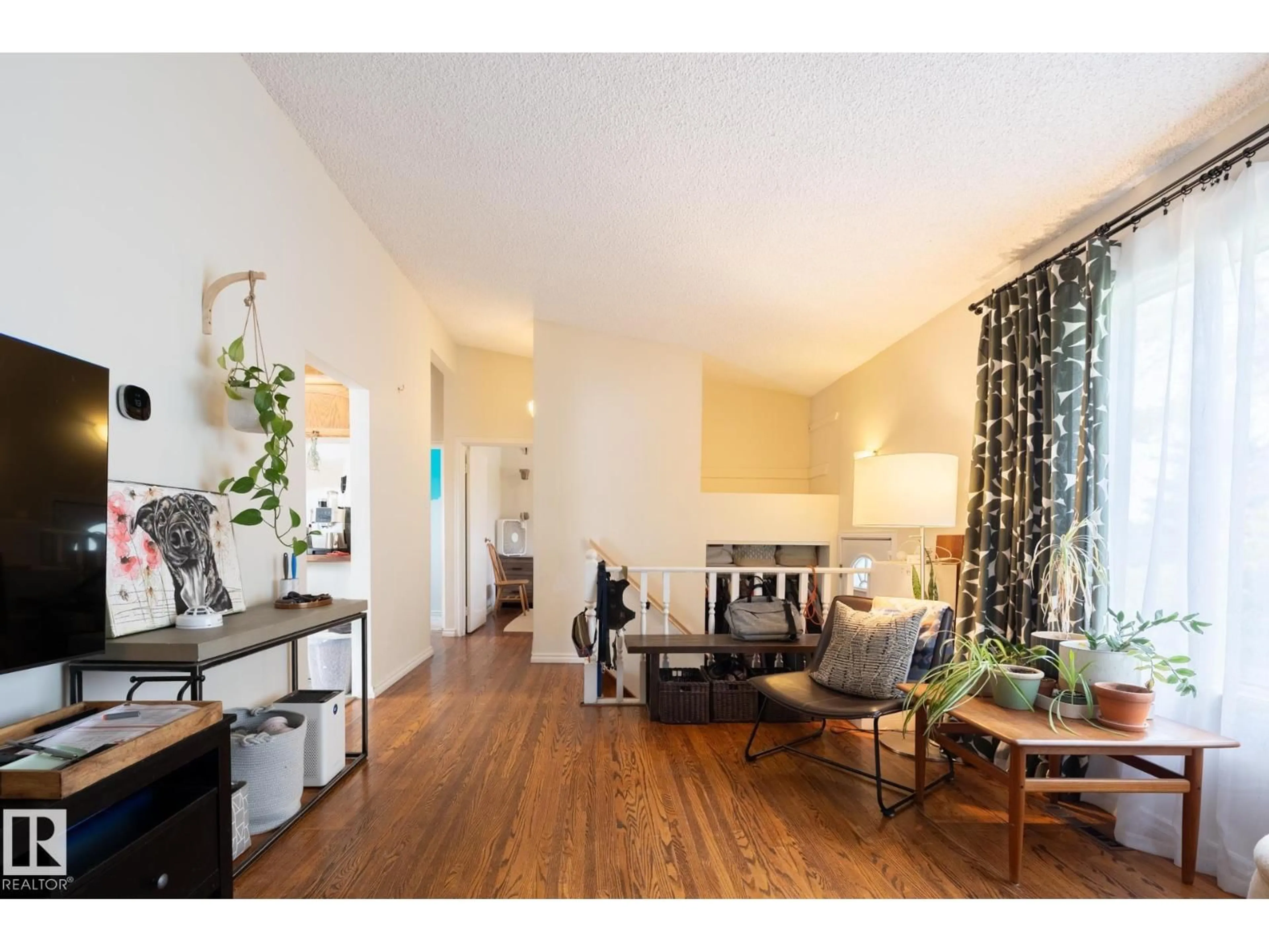 Living room with furniture, wood/laminate floor for NW - 10972 157 ST, Edmonton Alberta T5P2W3