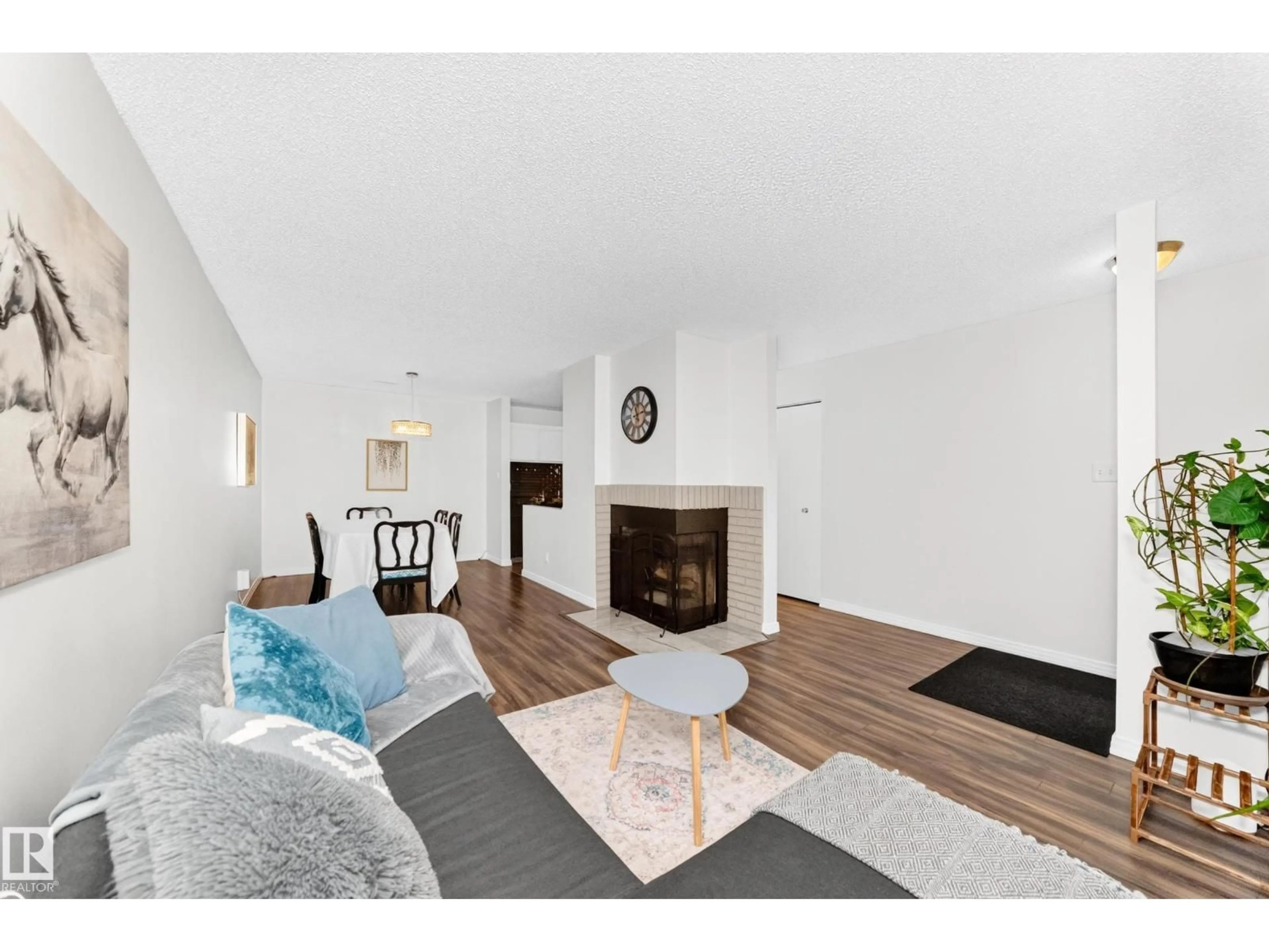 Living room with furniture, wood/laminate floor for 49 - 2115 118 ST, Edmonton Alberta T6J5N1