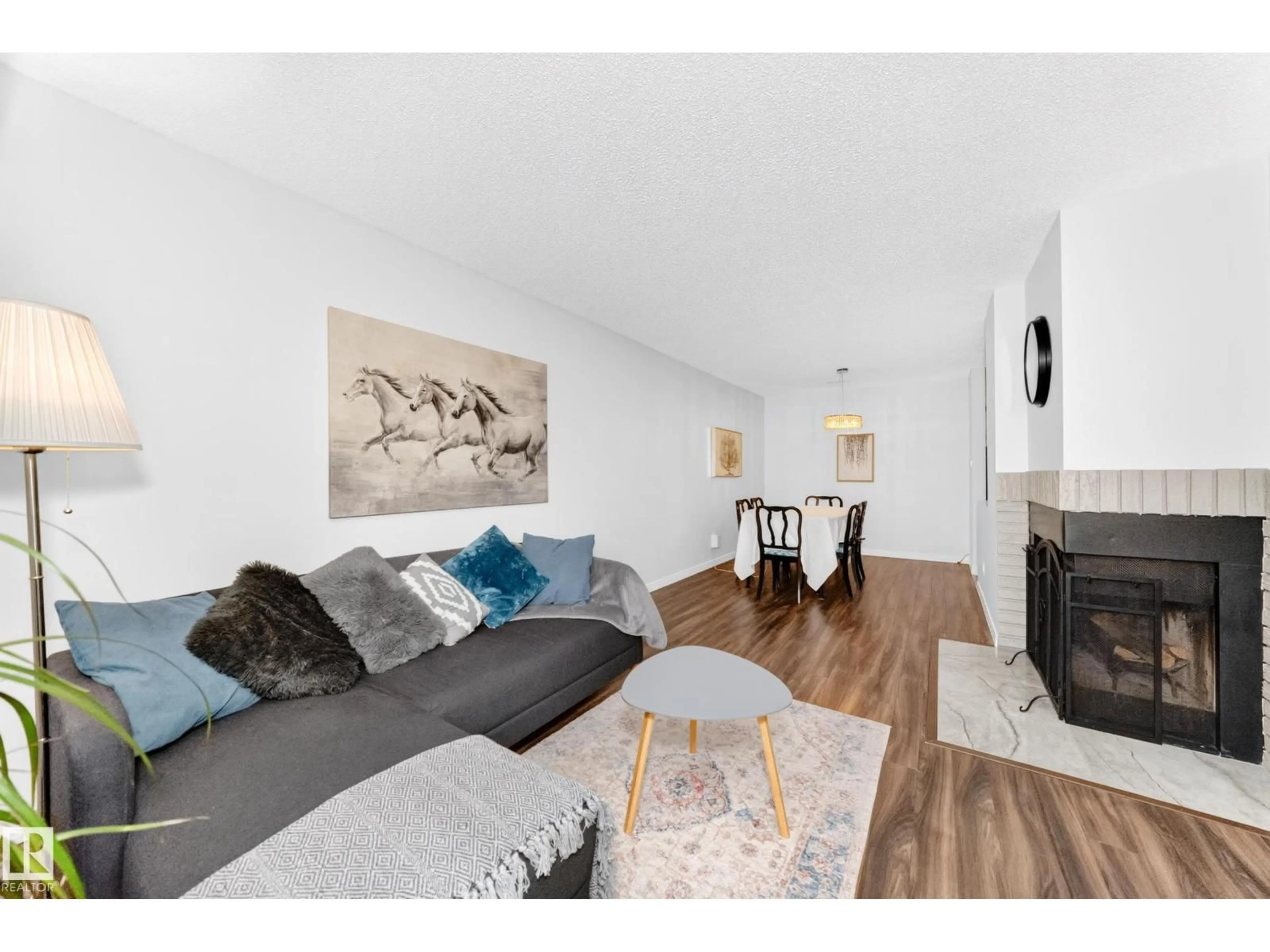 Living room with furniture, wood/laminate floor for 49 - 2115 118 ST, Edmonton Alberta T6J5N1