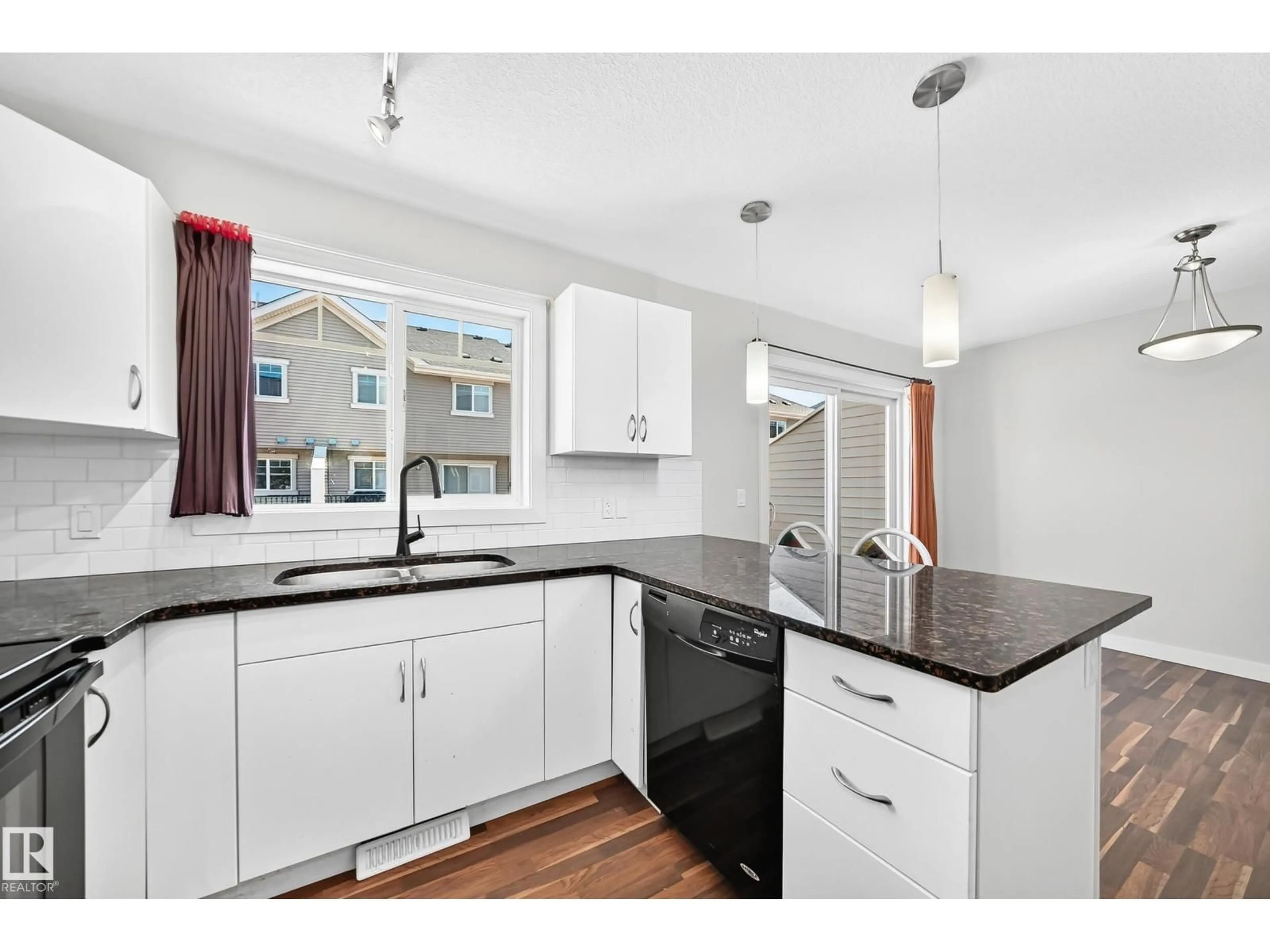 Open concept kitchen, wood/laminate floor for 39 - 7289 SOUTH TERWILLEGAR NW, Edmonton Alberta T6R0N5