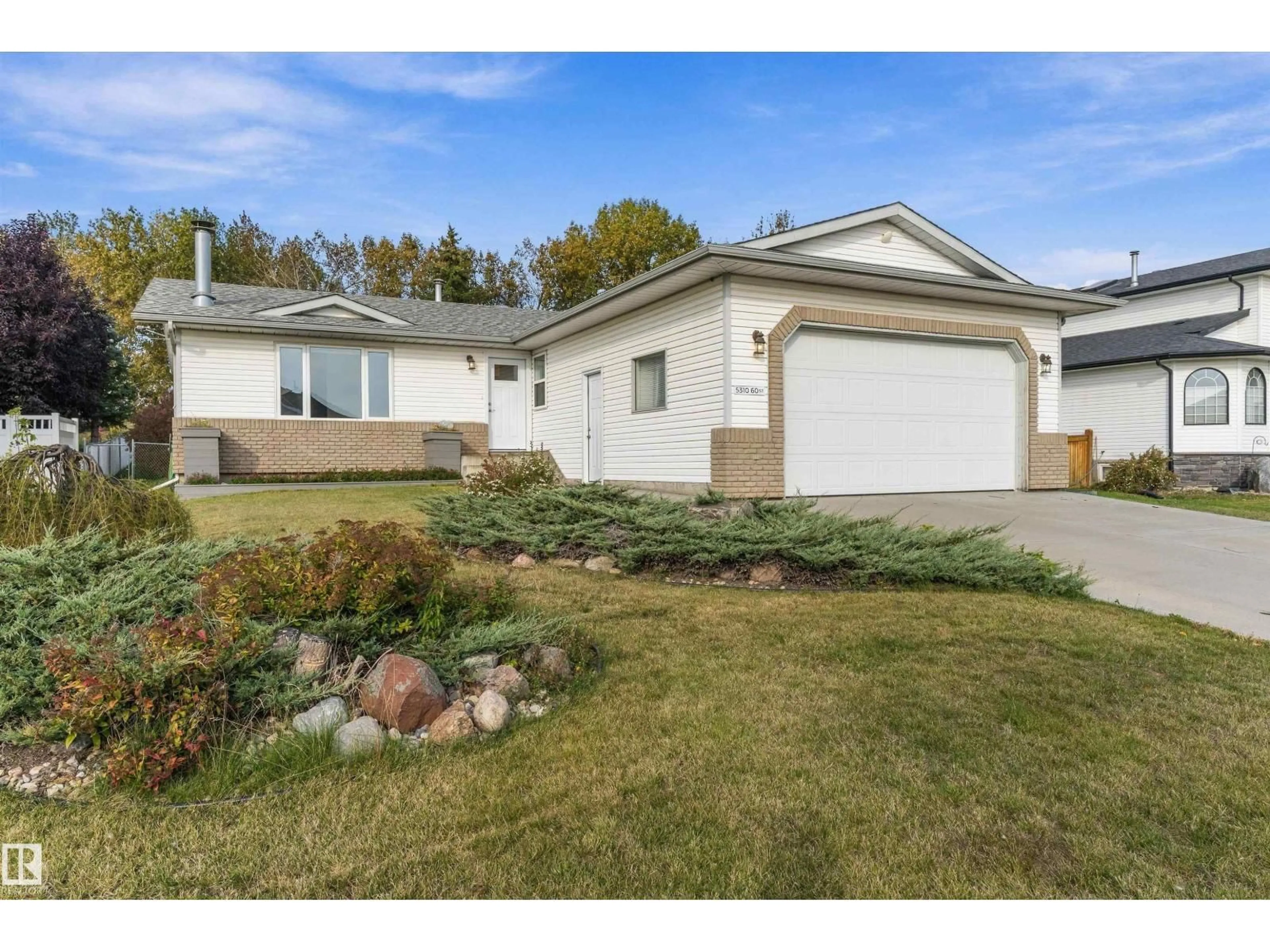 Home with vinyl exterior material, street for 5310 60, Camrose Alberta T4V4L2