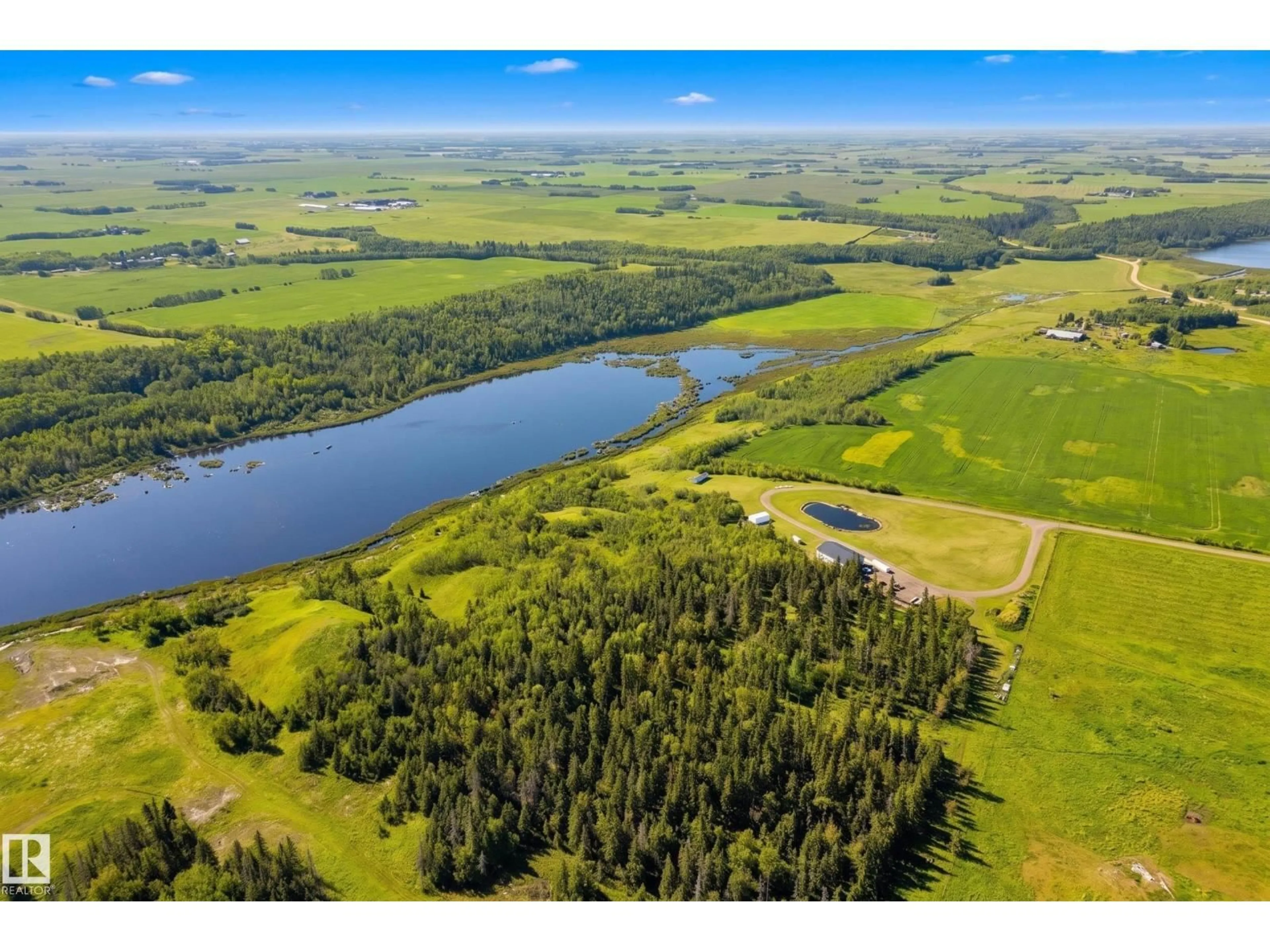 A pic from outside/outdoor area/front of a property/back of a property/a pic from drone, water/lake/river/ocean view for 49279 RGE RD 240, Rural Leduc County Alberta T4X0Z6