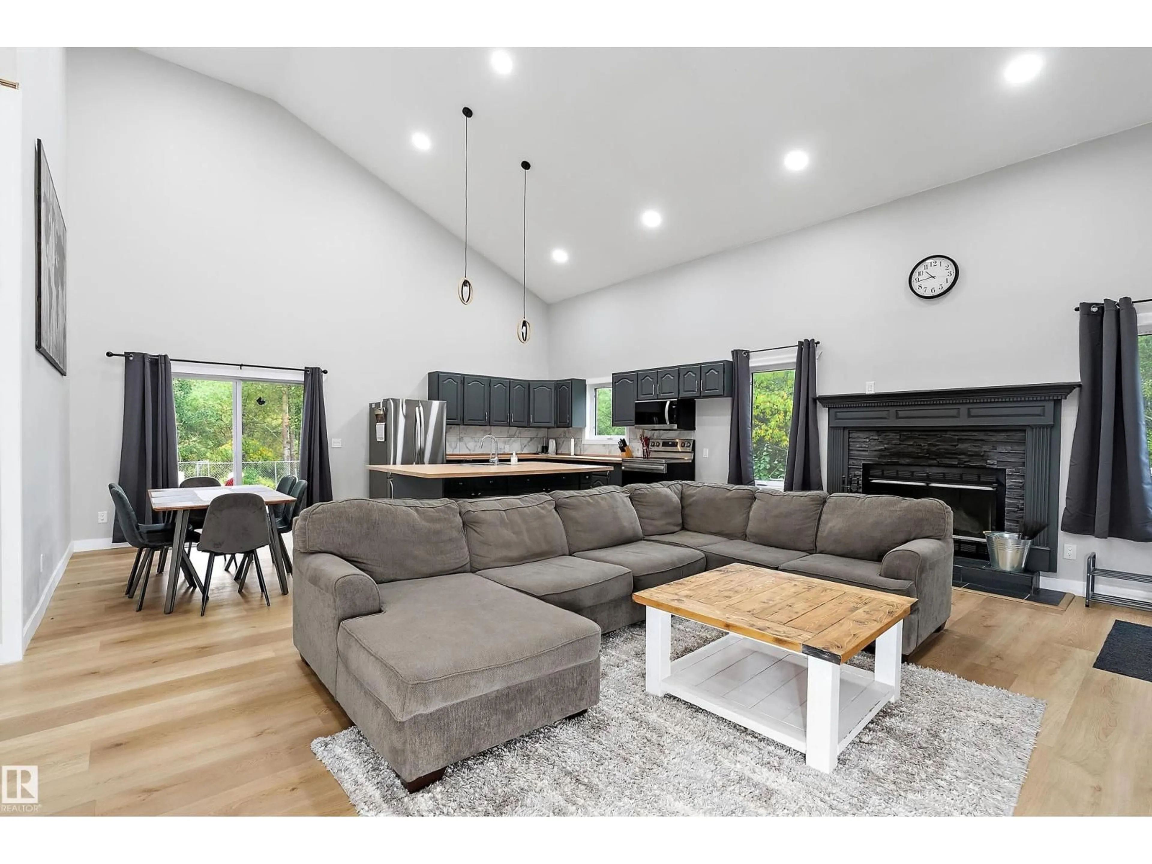 Living room with furniture, wood/laminate floor for 213 2ND AVENUE, Rural Wetaskiwin County Alberta T0C1X0