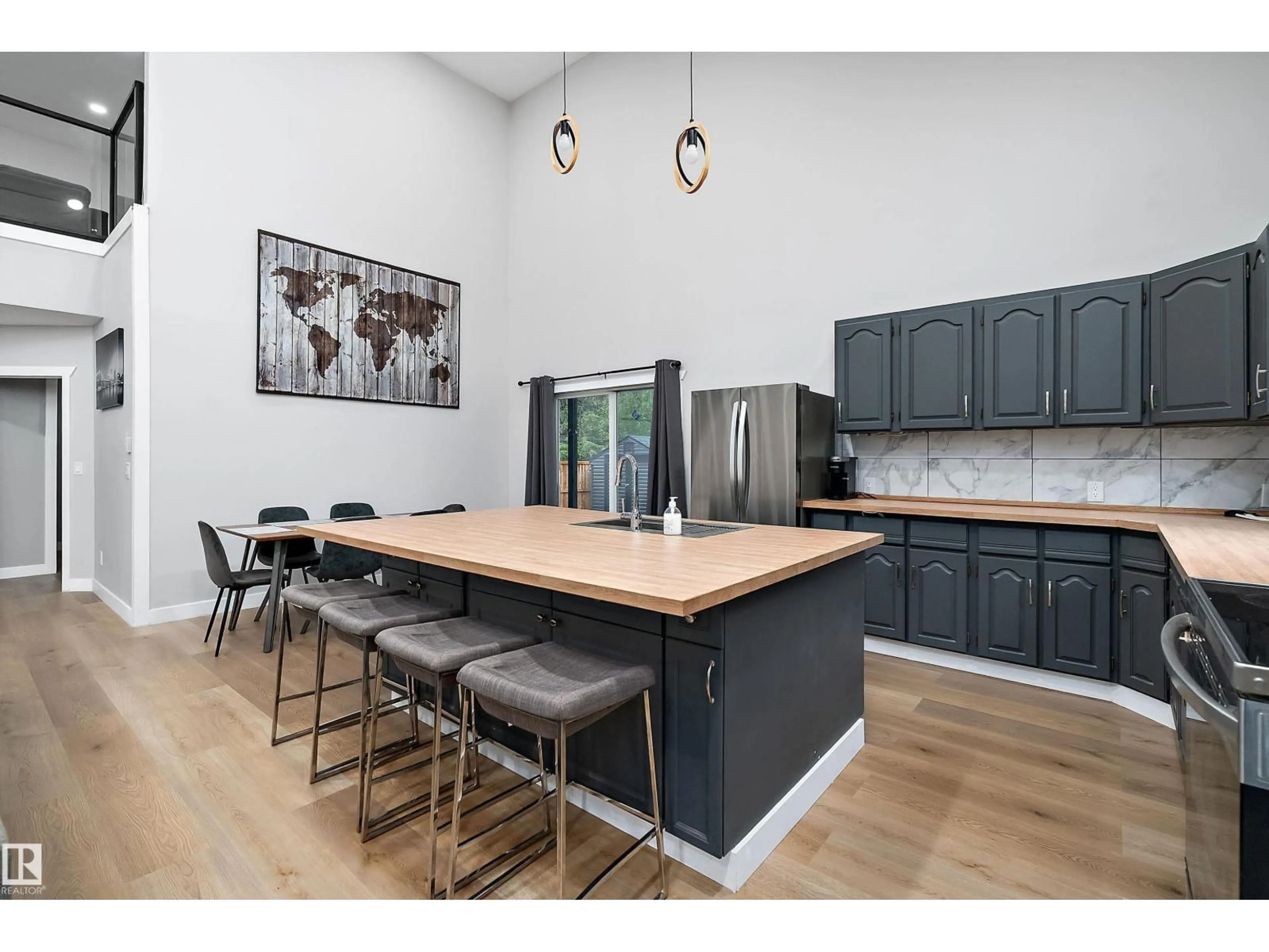 Open concept kitchen, wood/laminate floor for 213 2ND AVENUE, Rural Wetaskiwin County Alberta T0C1X0