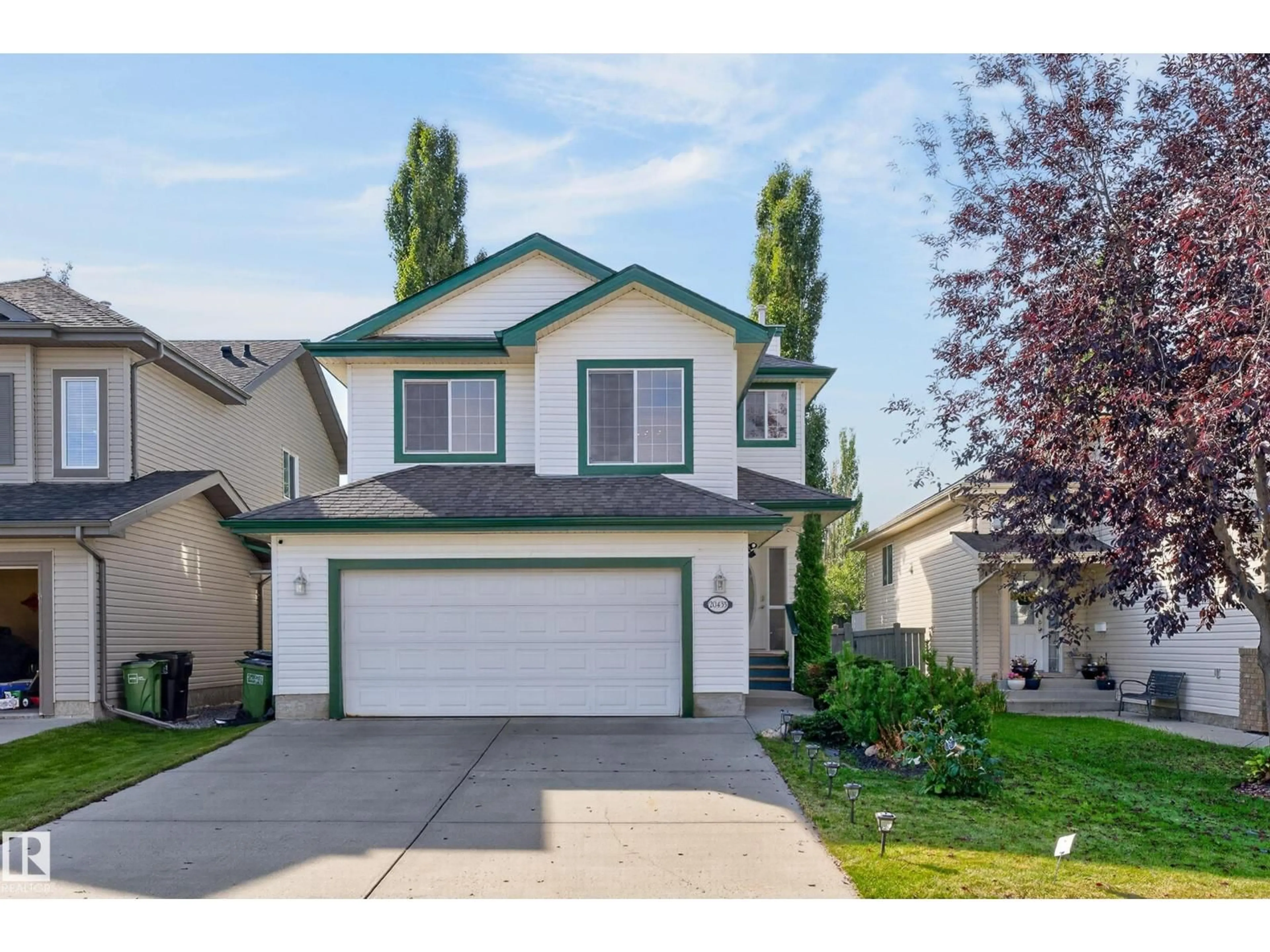 Home with vinyl exterior material, street for NW - 20435 56 AV, Edmonton Alberta T6M0B8