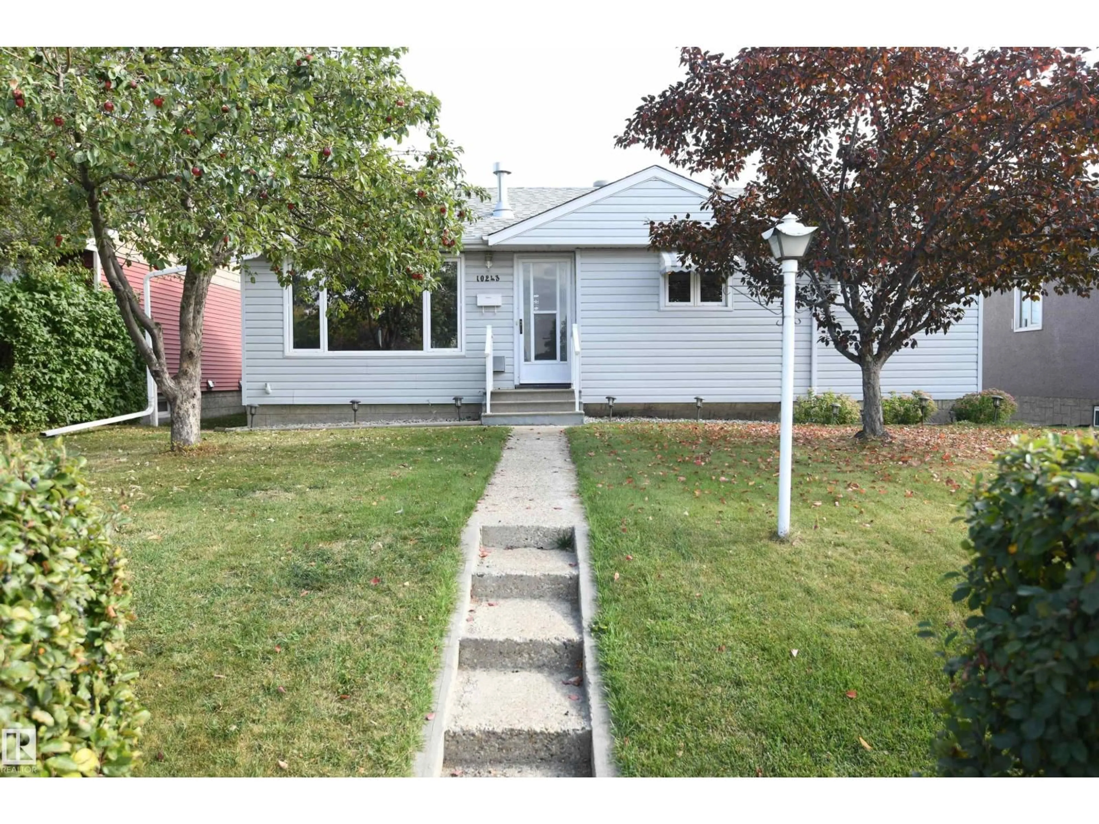 Home with vinyl exterior material, street for 10243 42 ST, Edmonton Alberta T6A1T3