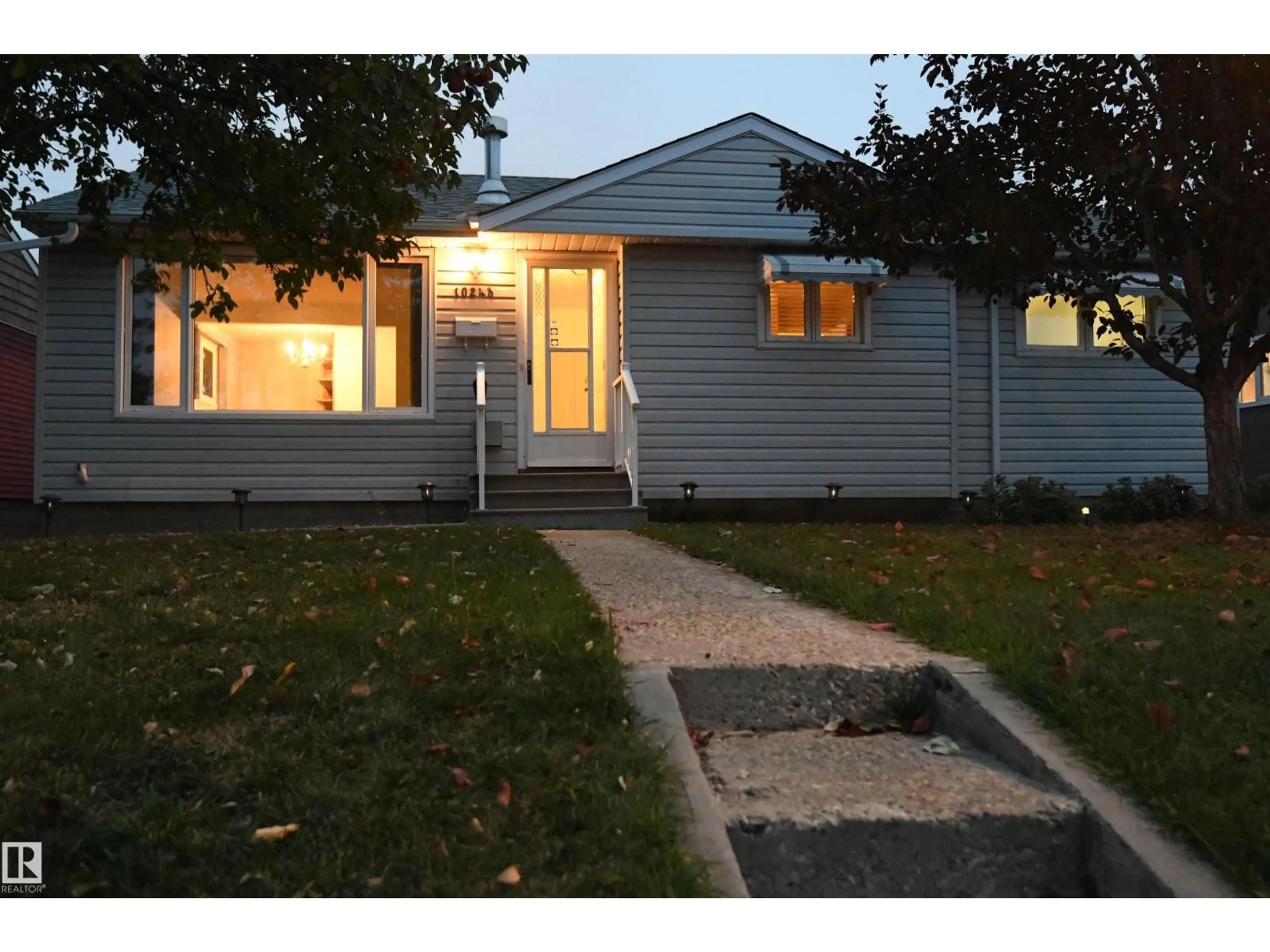 Home with vinyl exterior material, street for 10243 42 ST, Edmonton Alberta T6A1T3