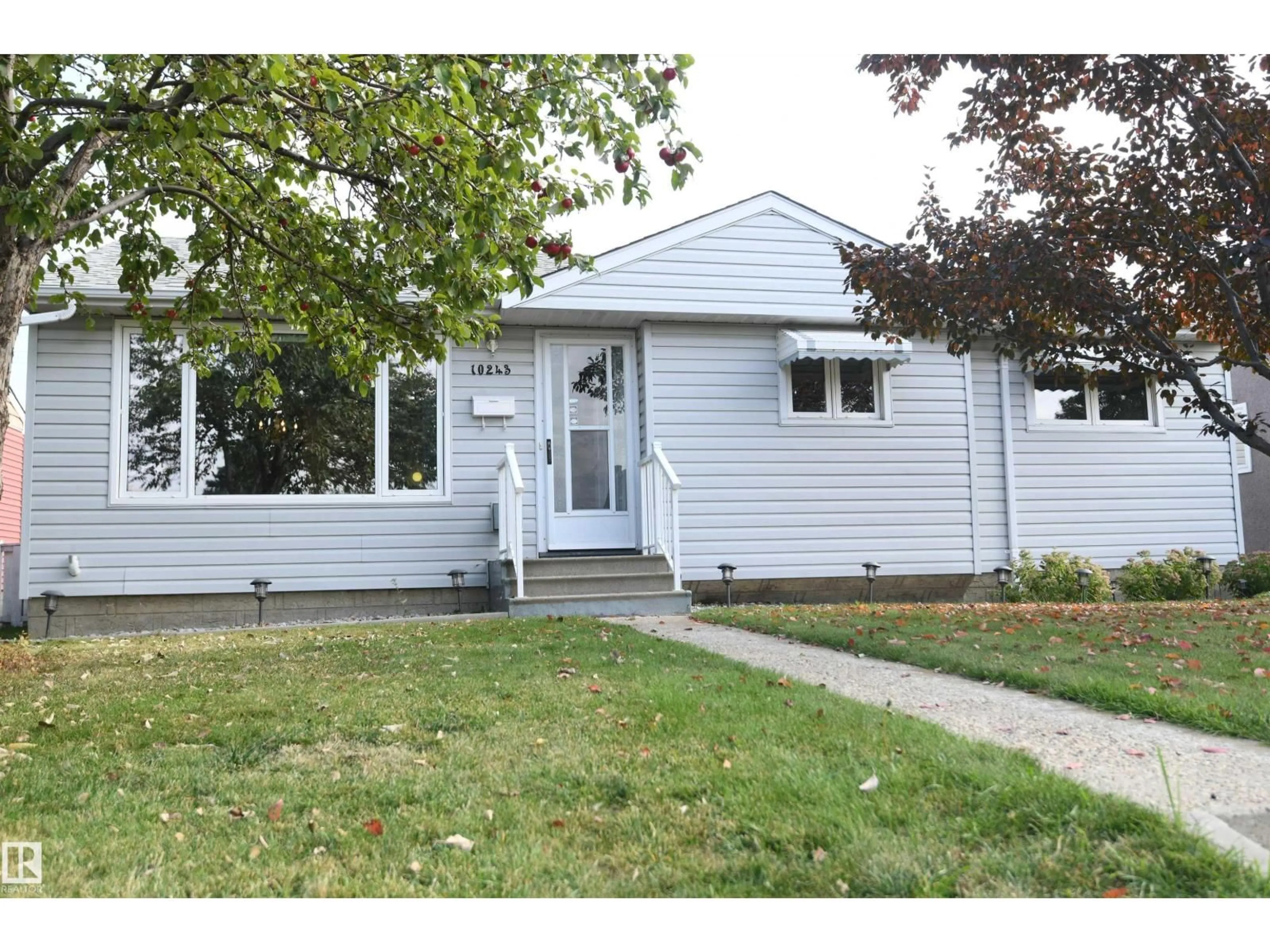 Home with vinyl exterior material, street for 10243 42 ST, Edmonton Alberta T6A1T3