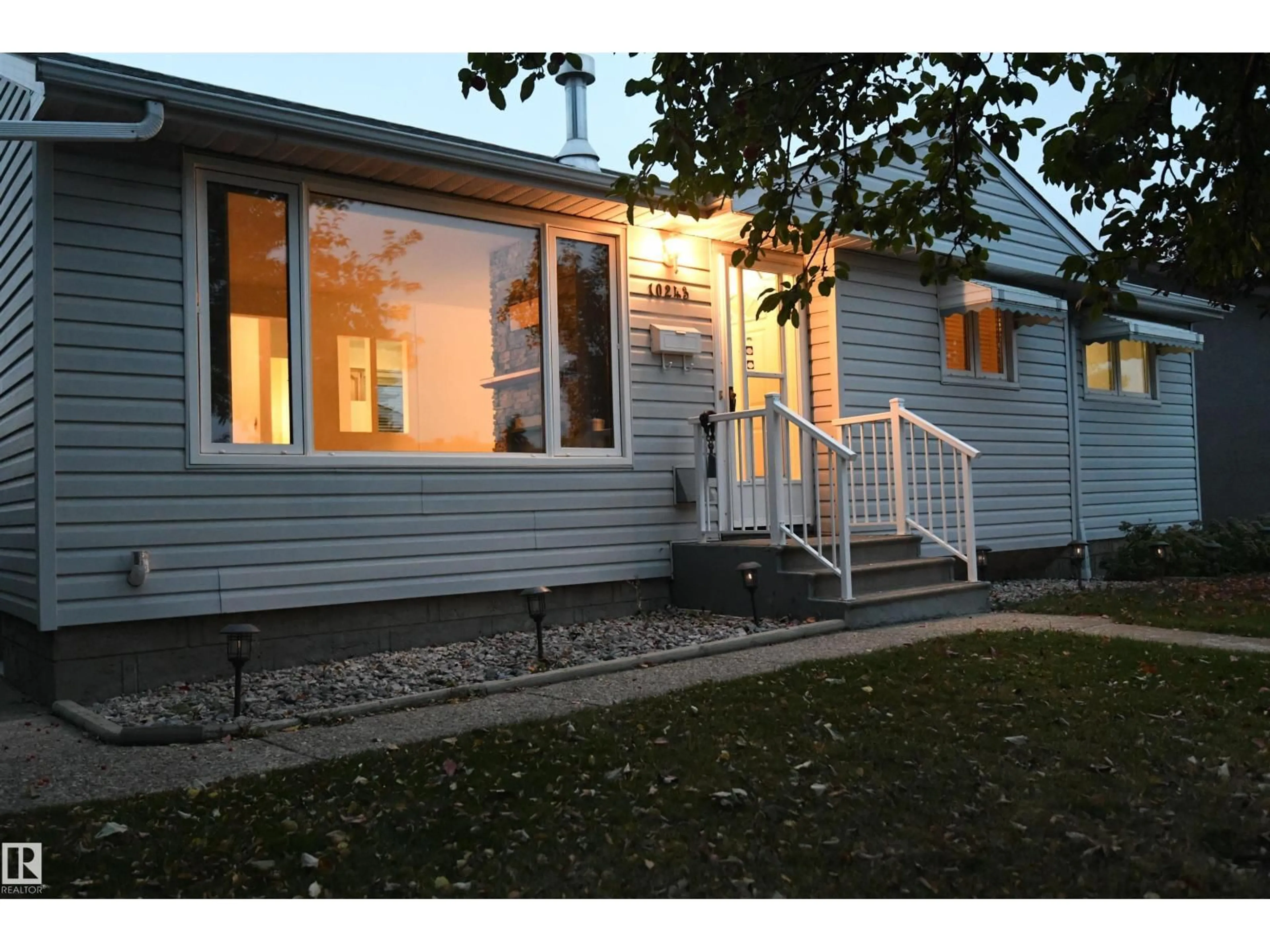 Home with vinyl exterior material, street for 10243 42 ST, Edmonton Alberta T6A1T3