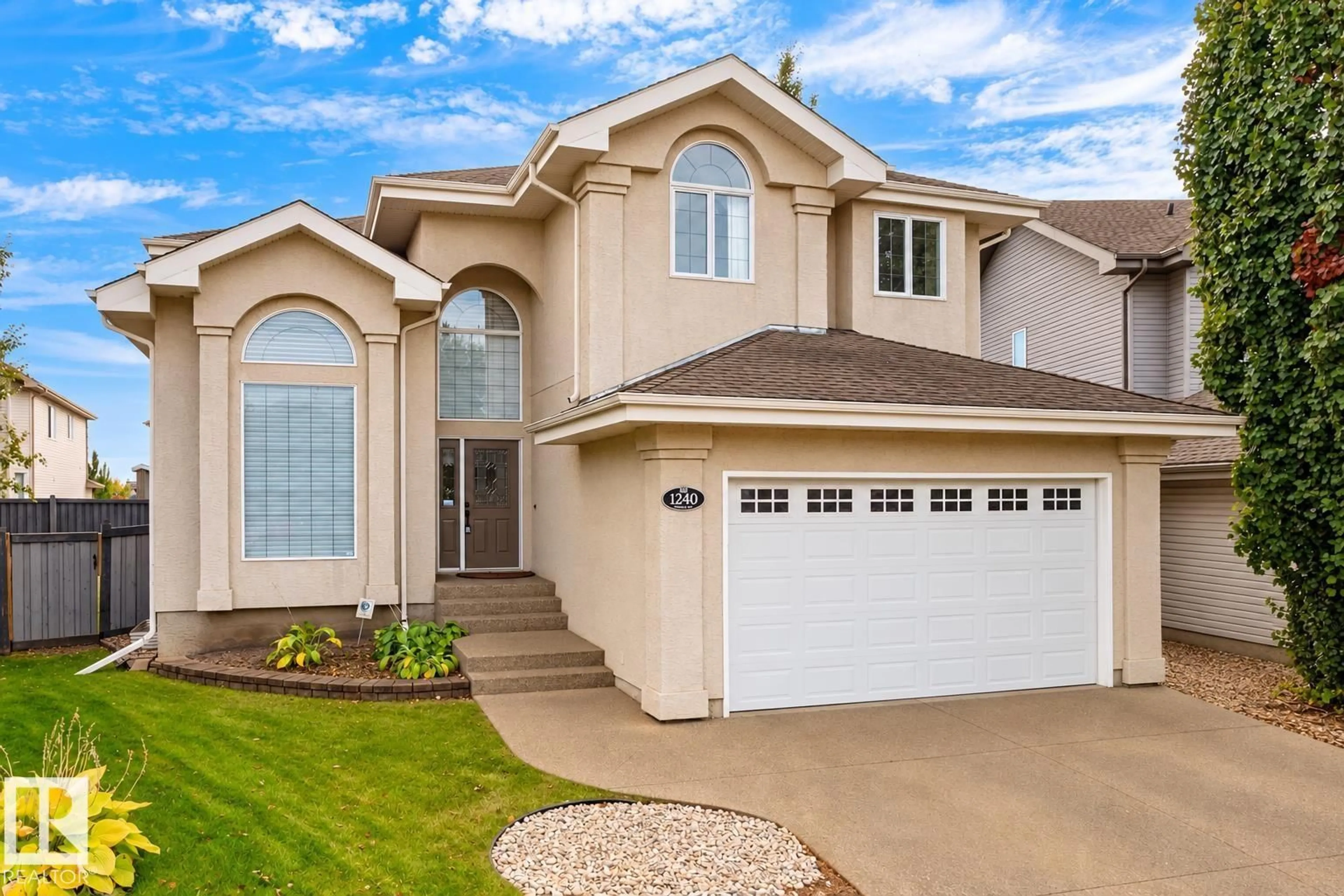 Home with vinyl exterior material, street for 1240 TREDGER CO, Edmonton Alberta T6R0B1