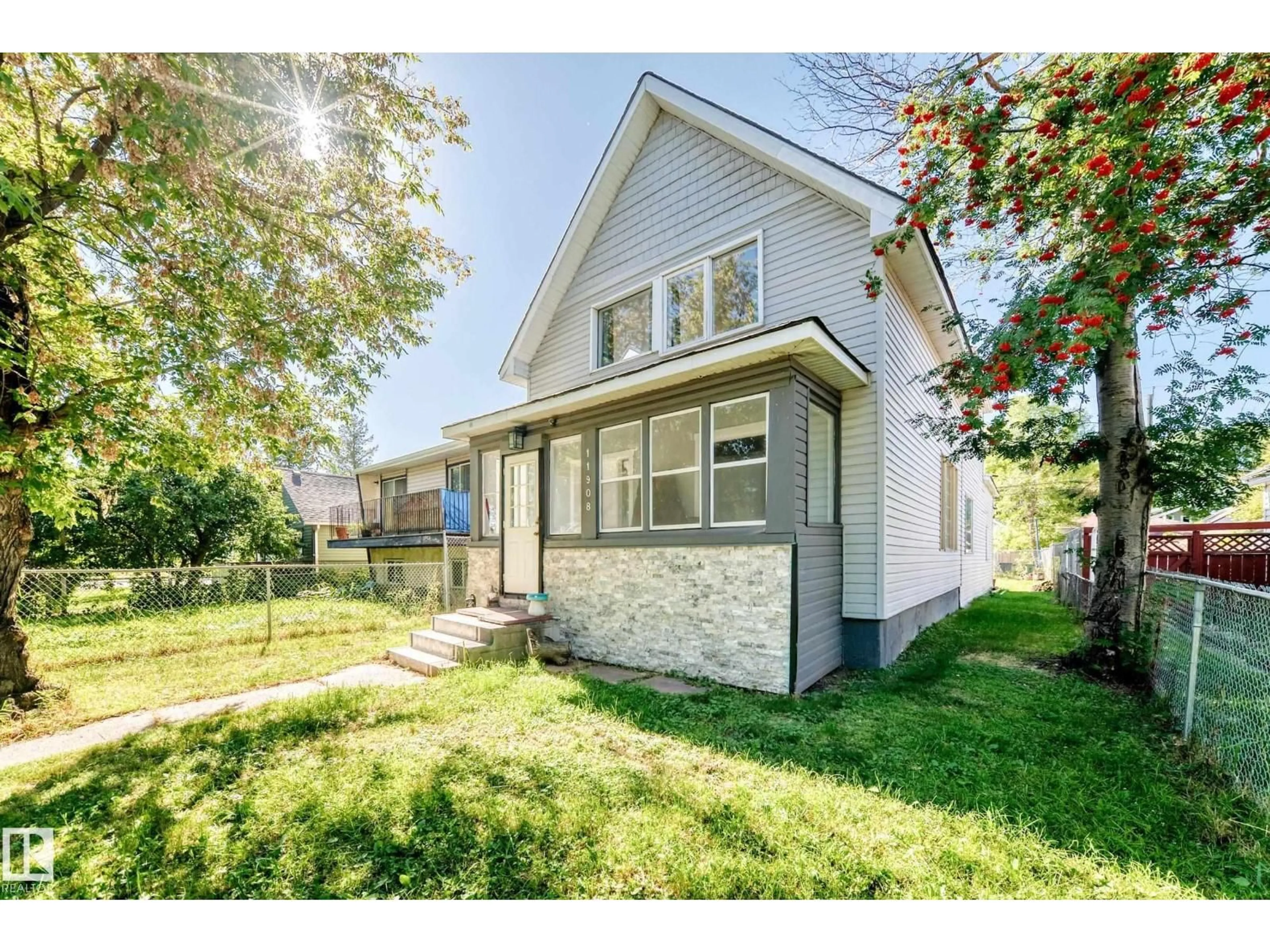 Home with vinyl exterior material, street for NW - 11908 77 ST, Edmonton Alberta T5B2G4