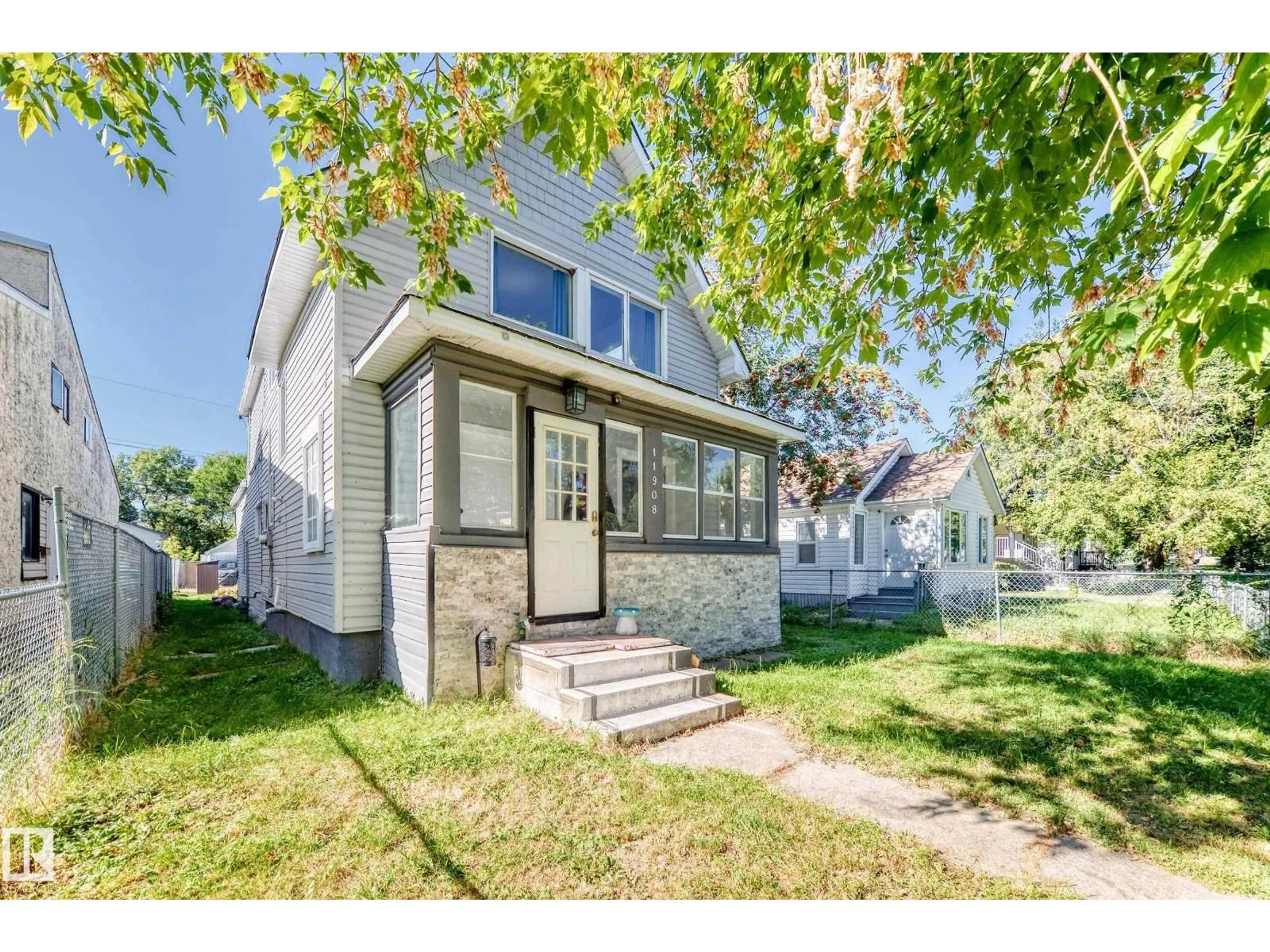 Home with vinyl exterior material, street for NW - 11908 77 ST, Edmonton Alberta T5B2G4