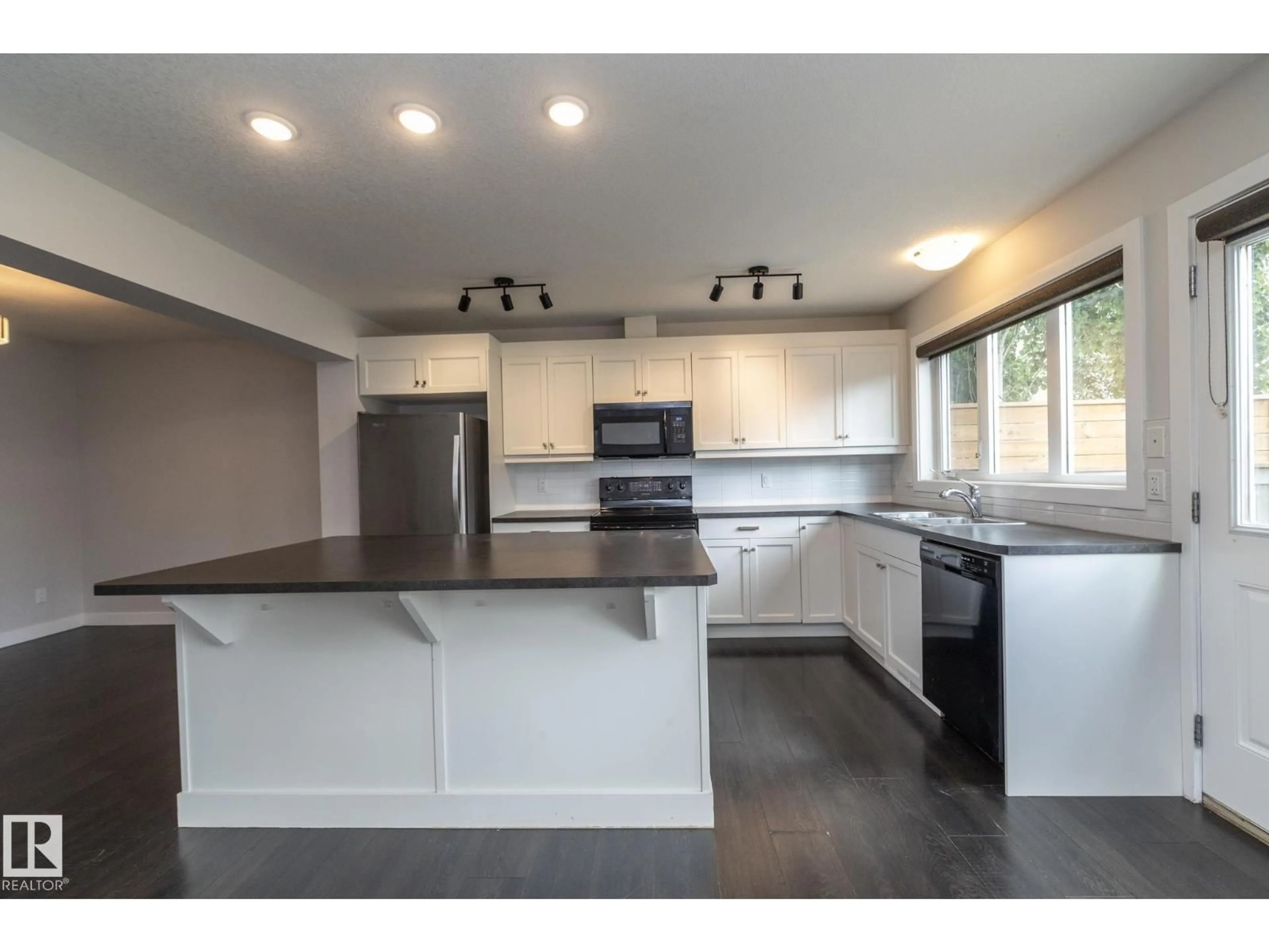 Open concept kitchen, wood/laminate floor for 55 MICHIGAN ST, Devon Alberta T9G1H7