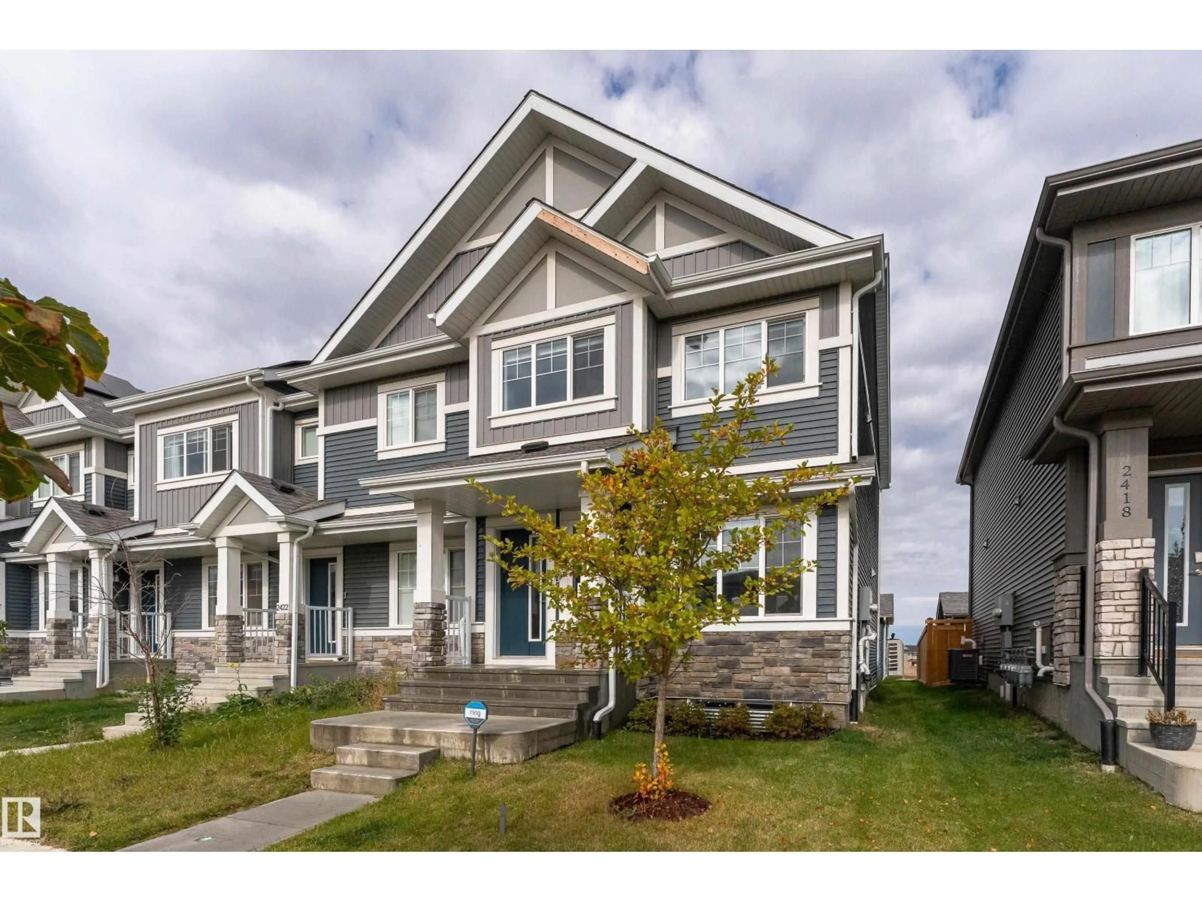 Home with vinyl exterior material, street for 2420 TRUMPETER WY, Edmonton Alberta T5S0R9