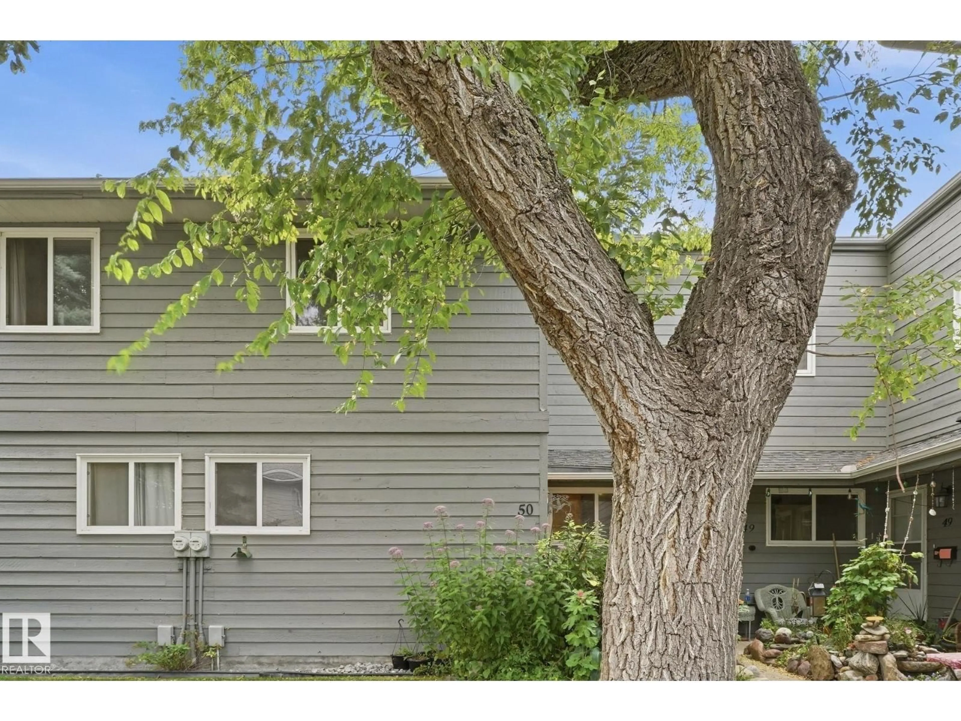 Home with vinyl exterior material, street for 50 - 4610 17 AV NW, Edmonton Alberta T6L5T1