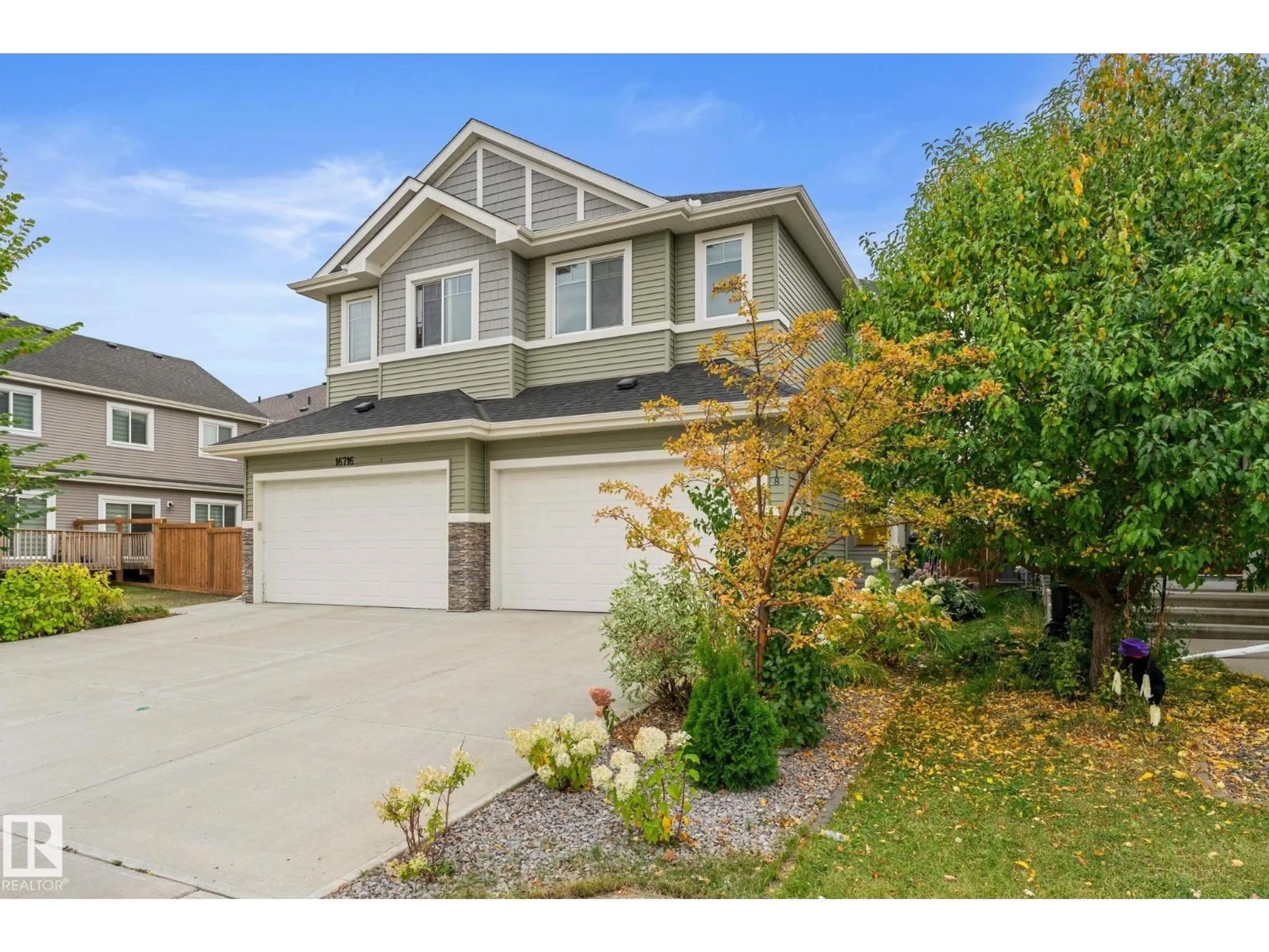 Home with vinyl exterior material, street for 16718 64 ST, Edmonton Alberta T5Y3P8