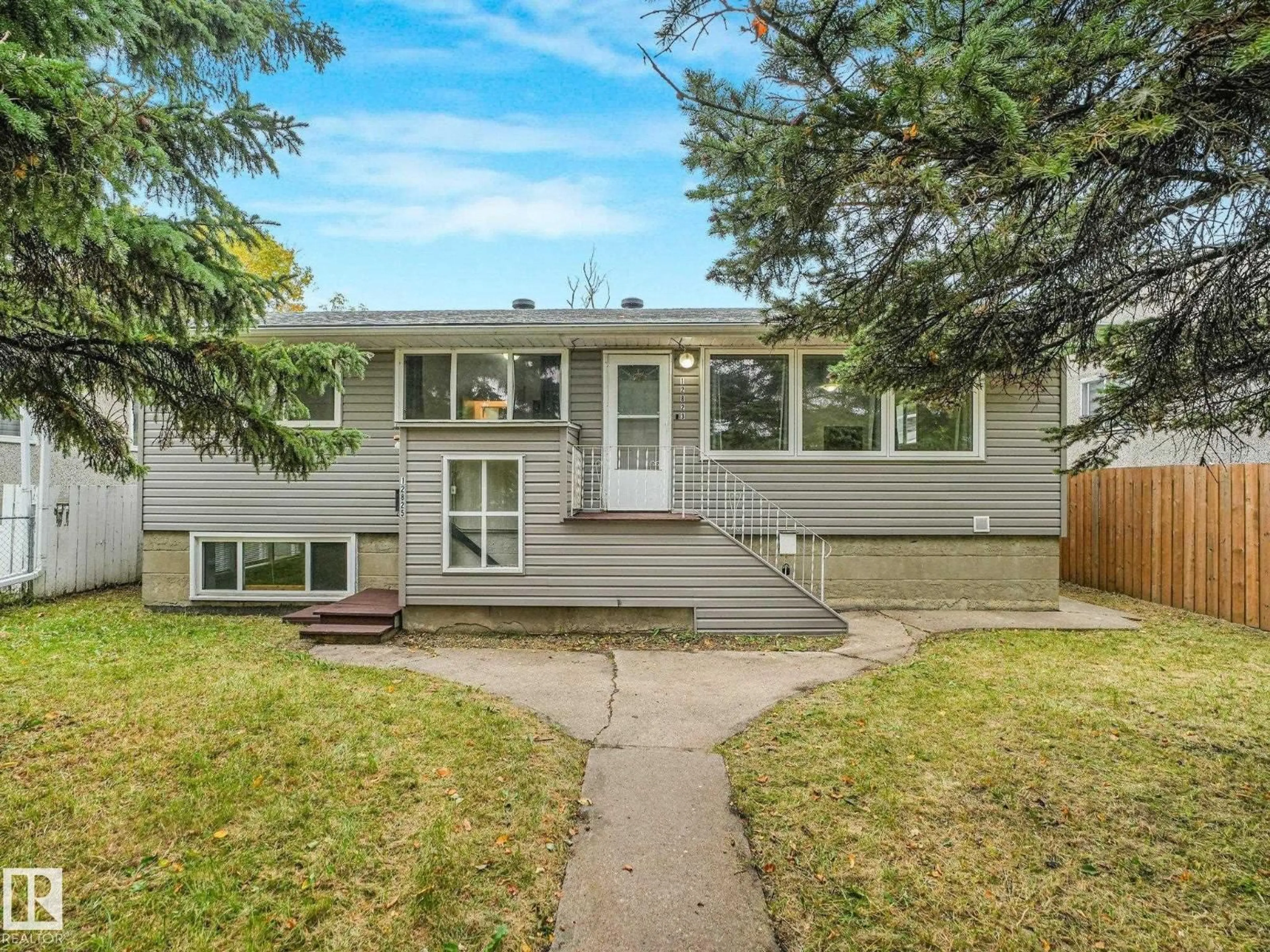 Home with vinyl exterior material, street for 12823 125 ST, Edmonton Alberta T5L0V1